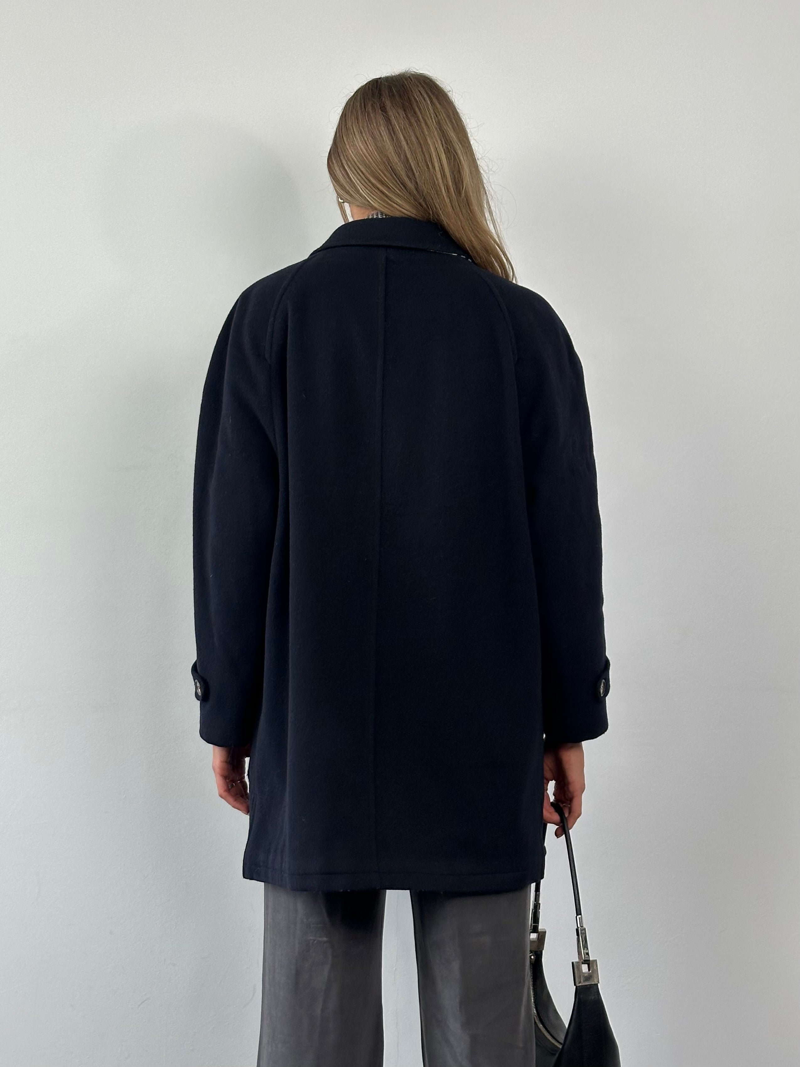 Burberry New Wool single-breasted coat in XL, featuring classic design, tailored fit, and neutral color, displayed on a hanger.