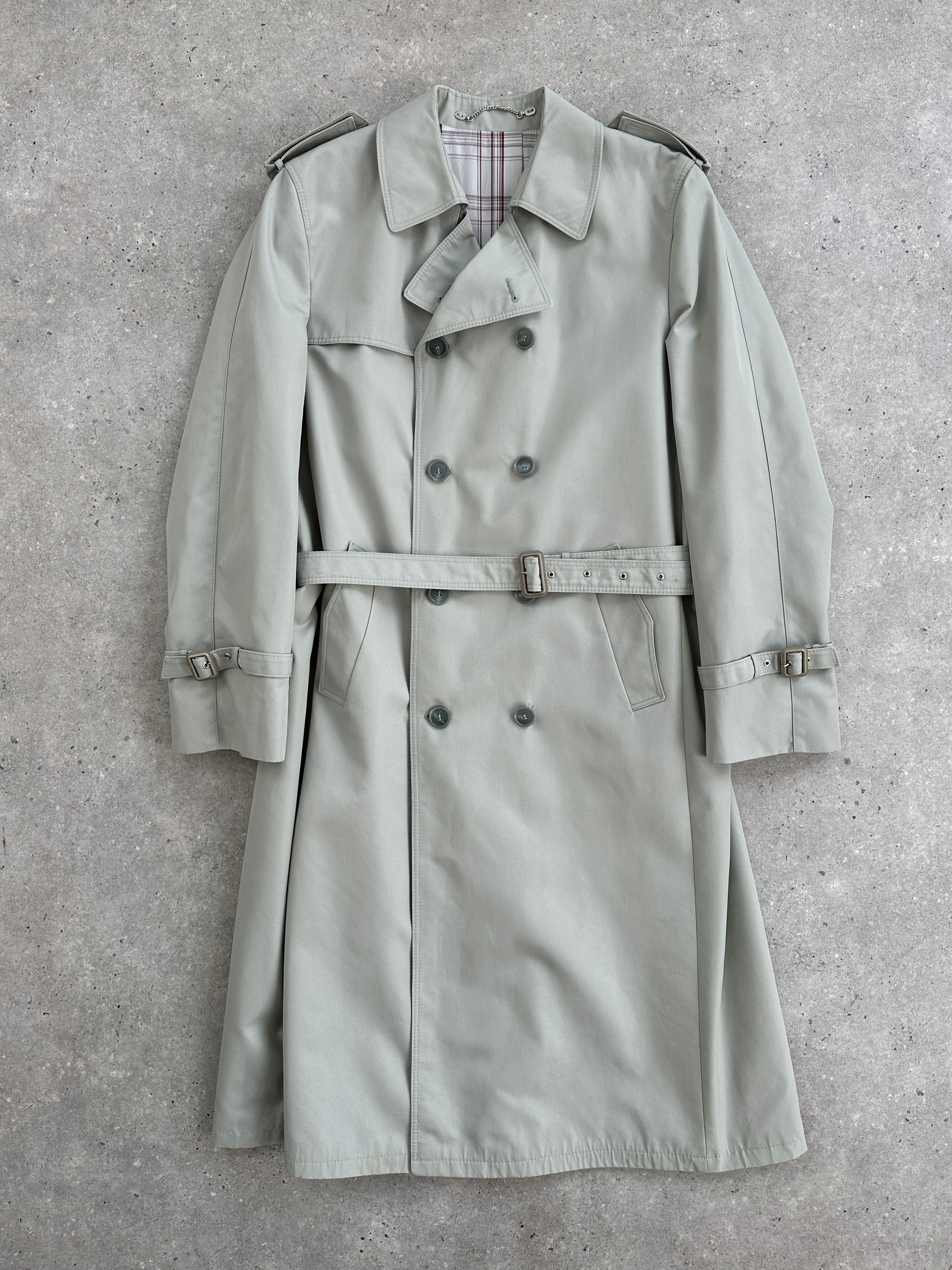 Vintage double-breasted belted trench coat in size XL, showing classic design with wide lapels and button details.