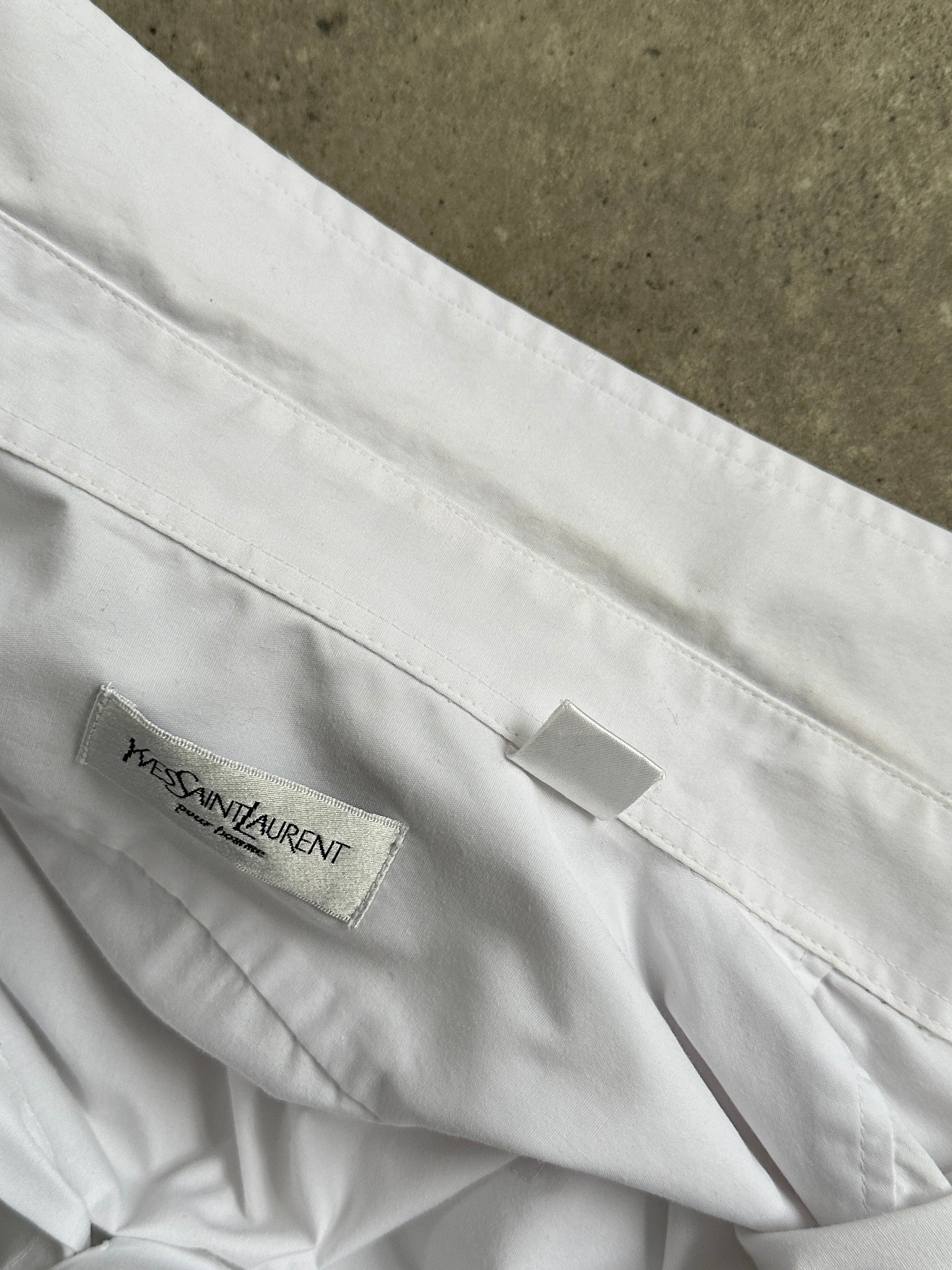 Yves Saint Laurent Pour Homme cotton short sleeve logo shirt in size L, featuring a classic design and brand logo on the chest.