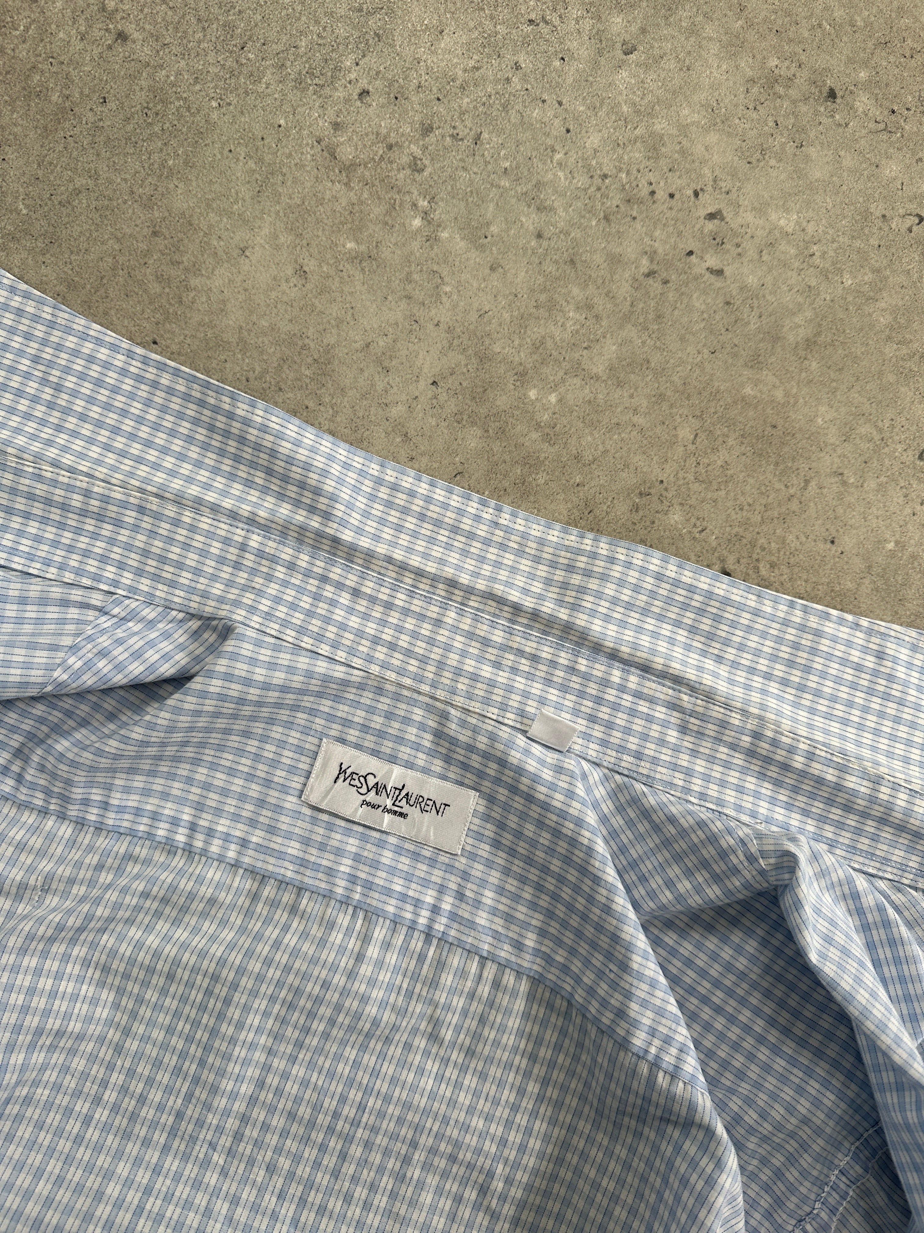 Yves Saint Laurent Pour Homme check logo cotton shirt in size M/L displayed on a hanger with a classic design.