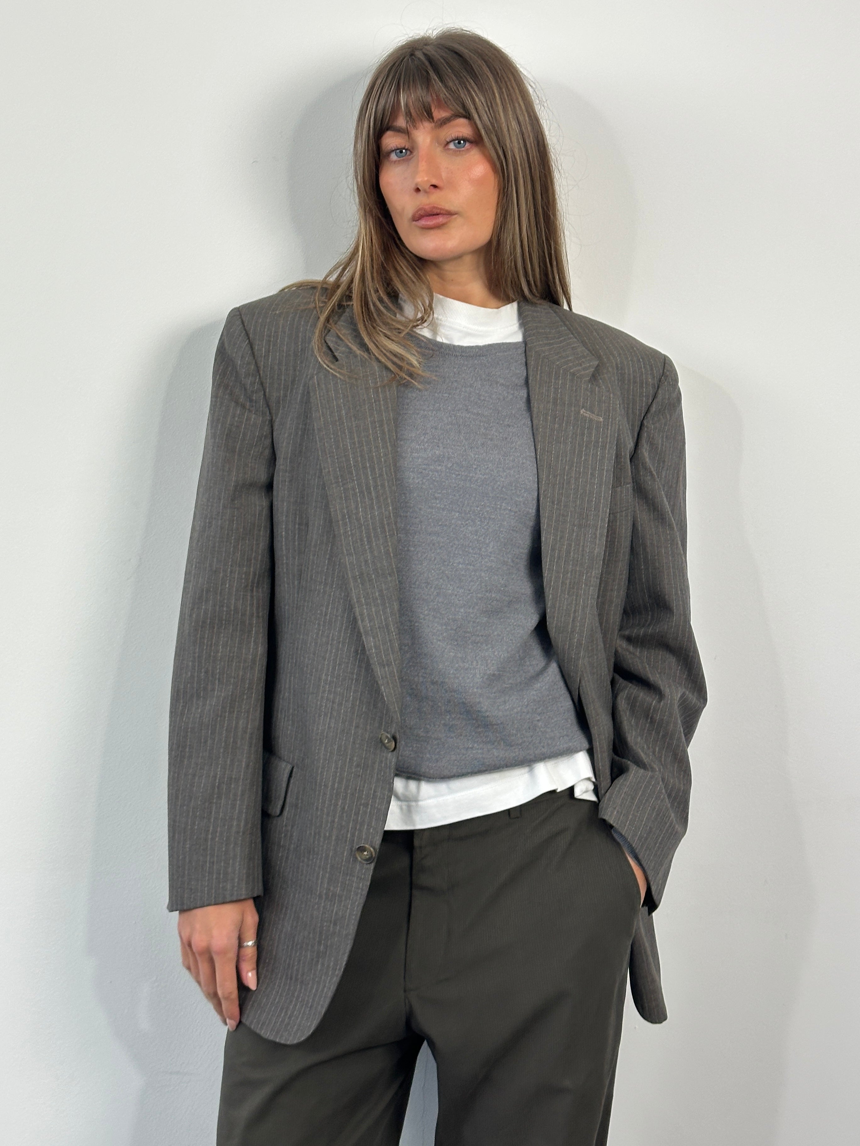 Christian Dior Monsieur 1990s striped single-breasted blazer in size 40R/L, tailored fit with classic lapel and button closure.