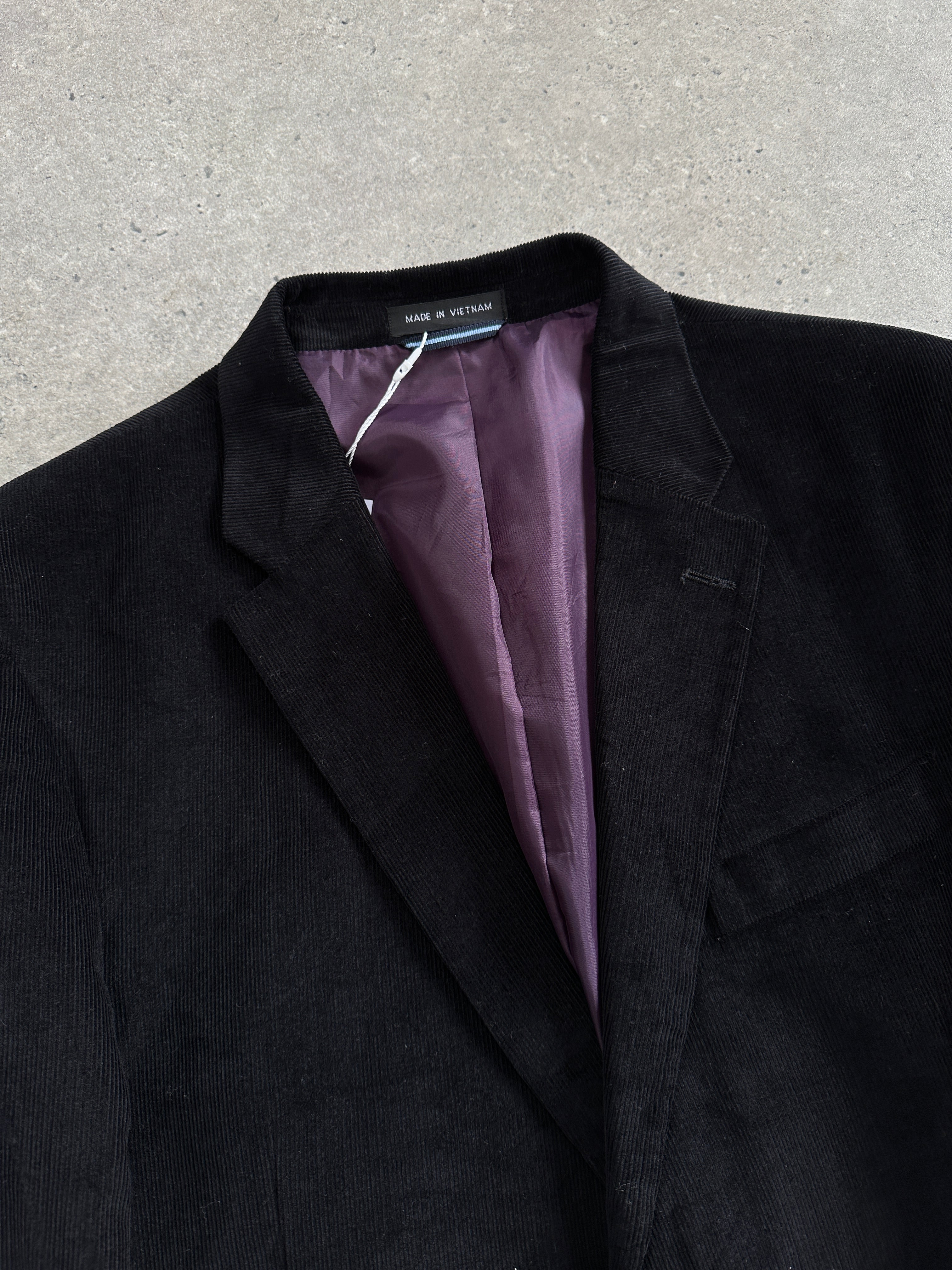 Tommy Hilfiger men's corduroy blazer in size 42L/XL, single-breasted style, shown on a hanger with a classic collar and button closure.
