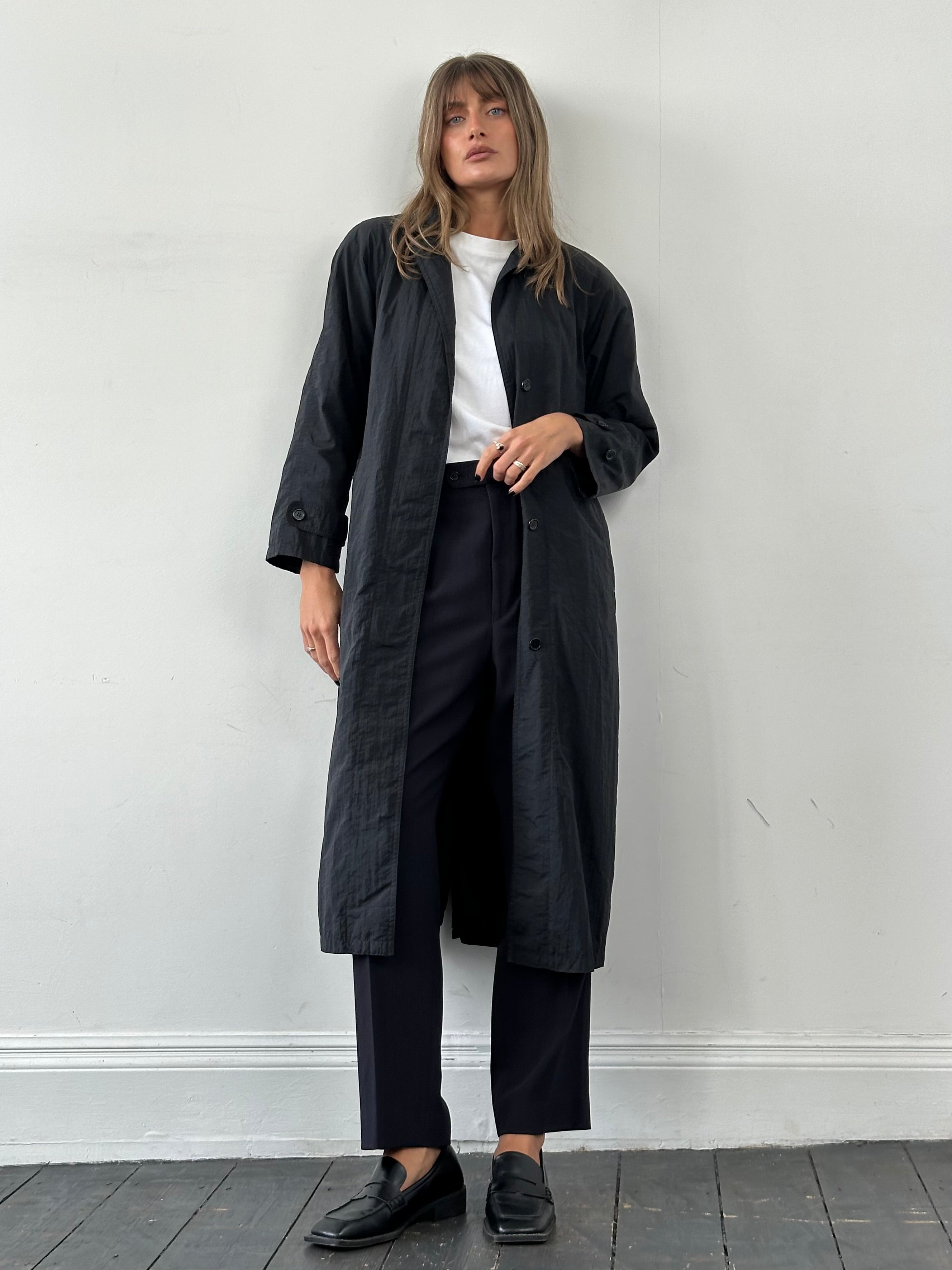 Vintage nylon trench coat with concealed placket, lightweight and stylish, in size S, featuring classic design and sleek fabric.