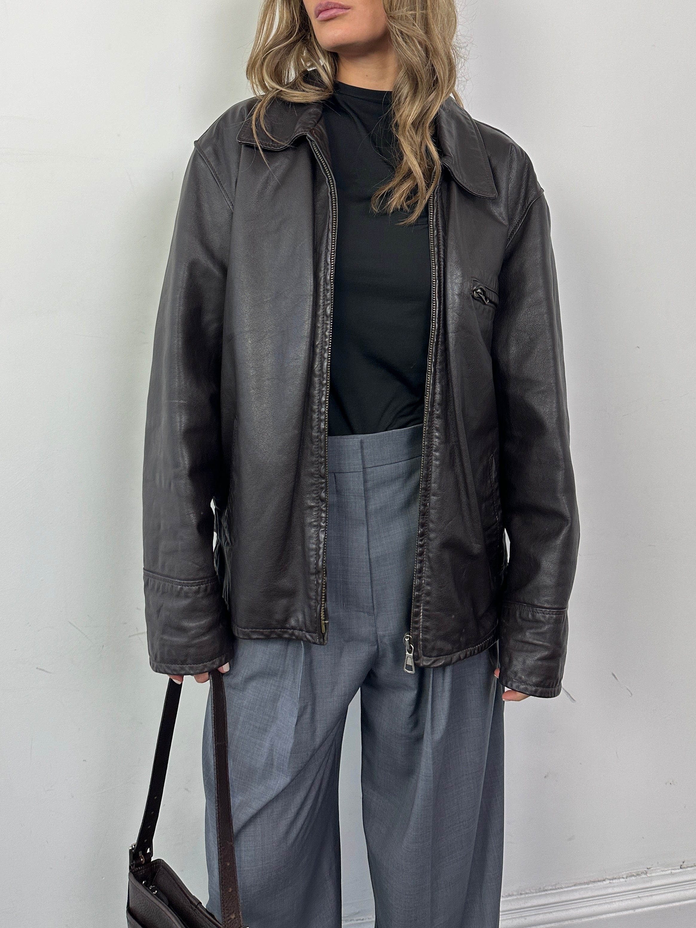 Italian Vintage Leather Jacket in size L/XL, classic distressed leather with vintage-style stitching and collar detail.