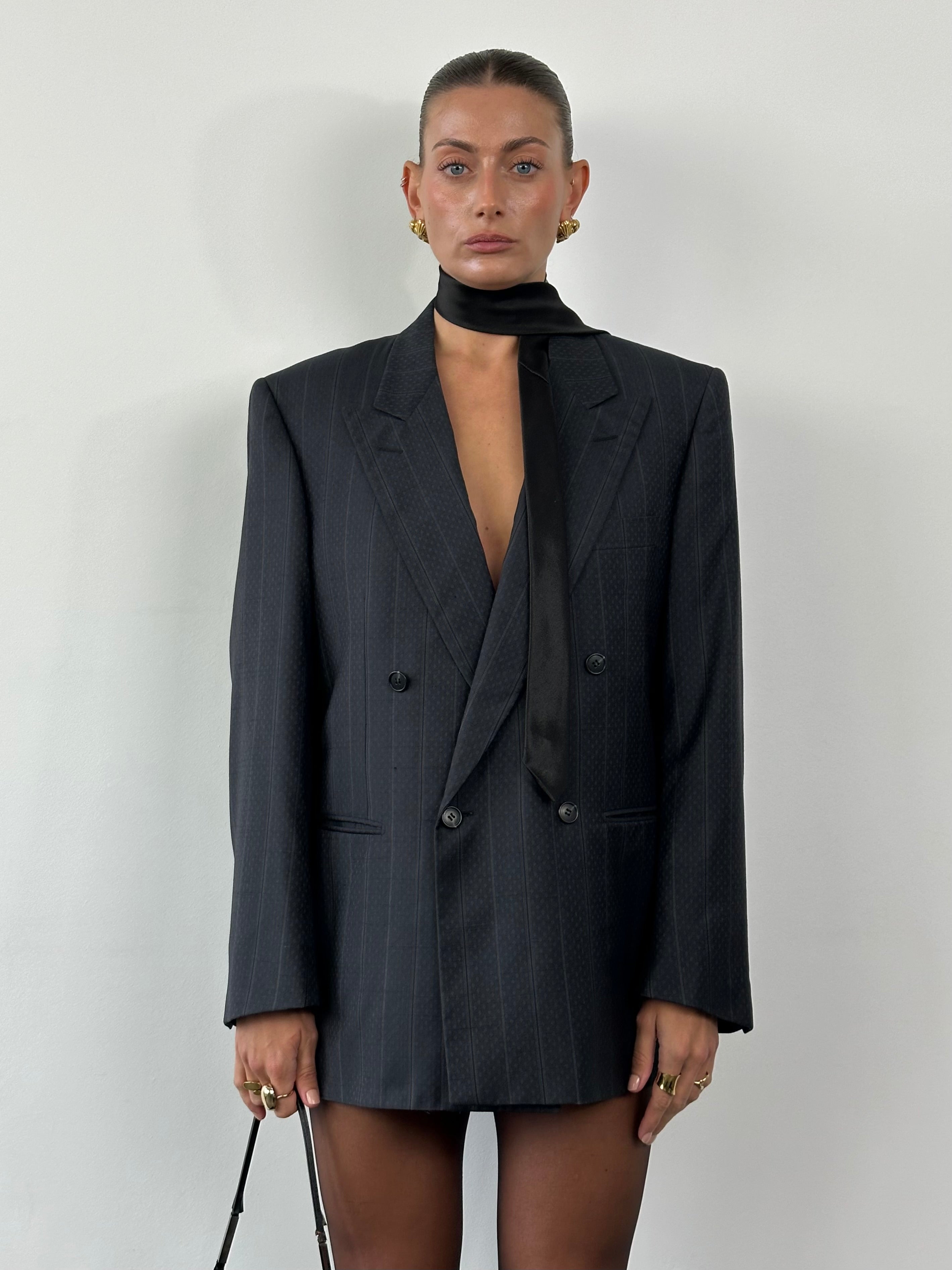 Christian Dior wool silk double-breasted print blazer in size 40R/L, featuring a tailored fit and elegant design.