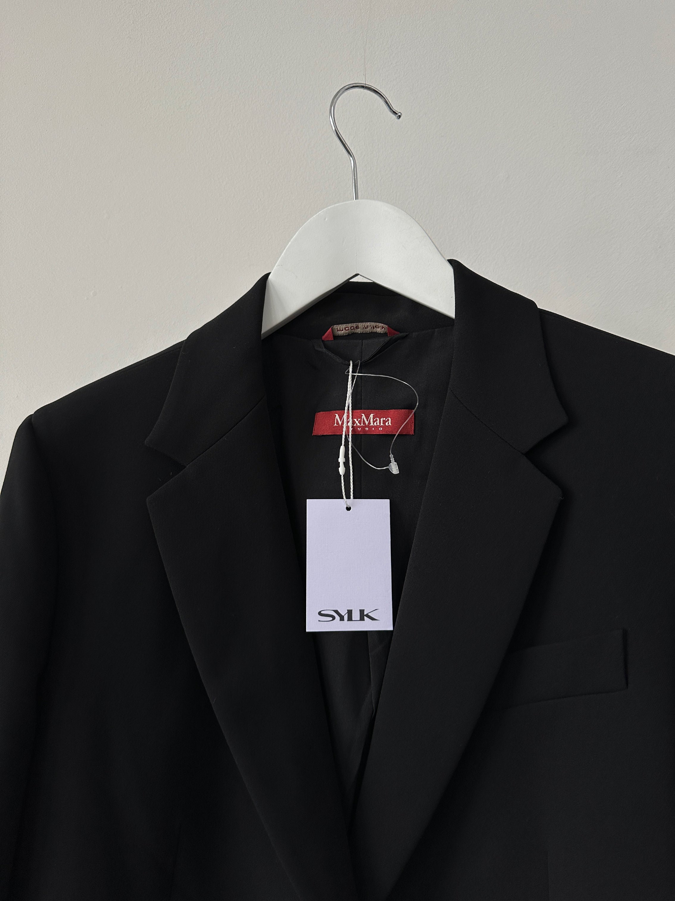 Max Mara Studio single-breasted blazer in black, tailored fit, with notch lapel and button closure, displayed on a hanger.