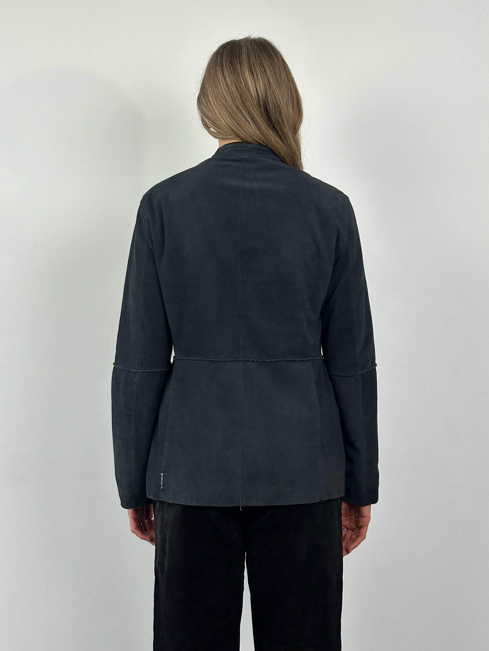 Armani Jeans fitted suede jacket in size M, showcasing its stylish design and textured material on a neutral background.
