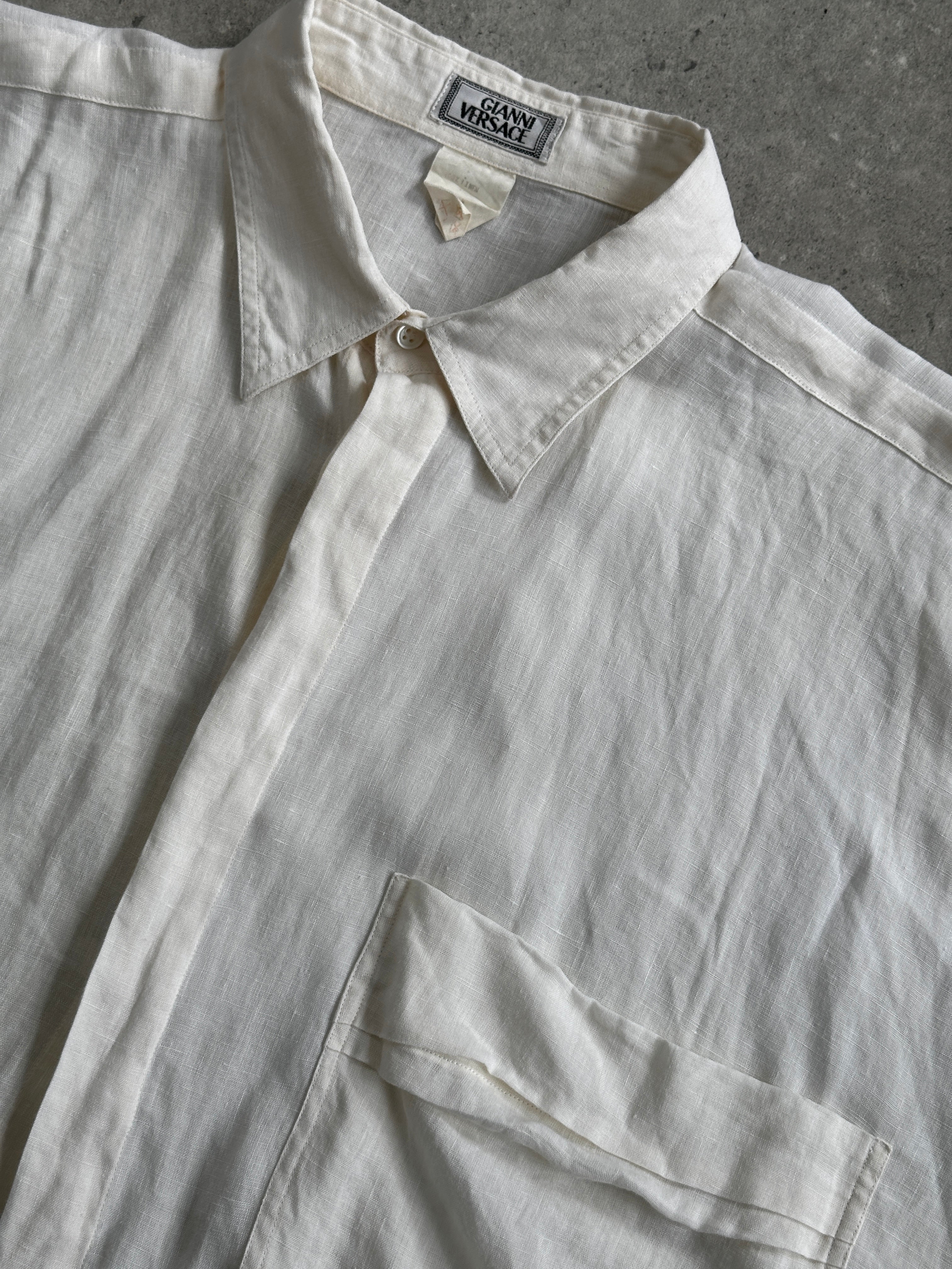 Gianni Versace 90s oversized pure linen shirt in XL, featuring a relaxed fit and classic design, displayed on a hanger.