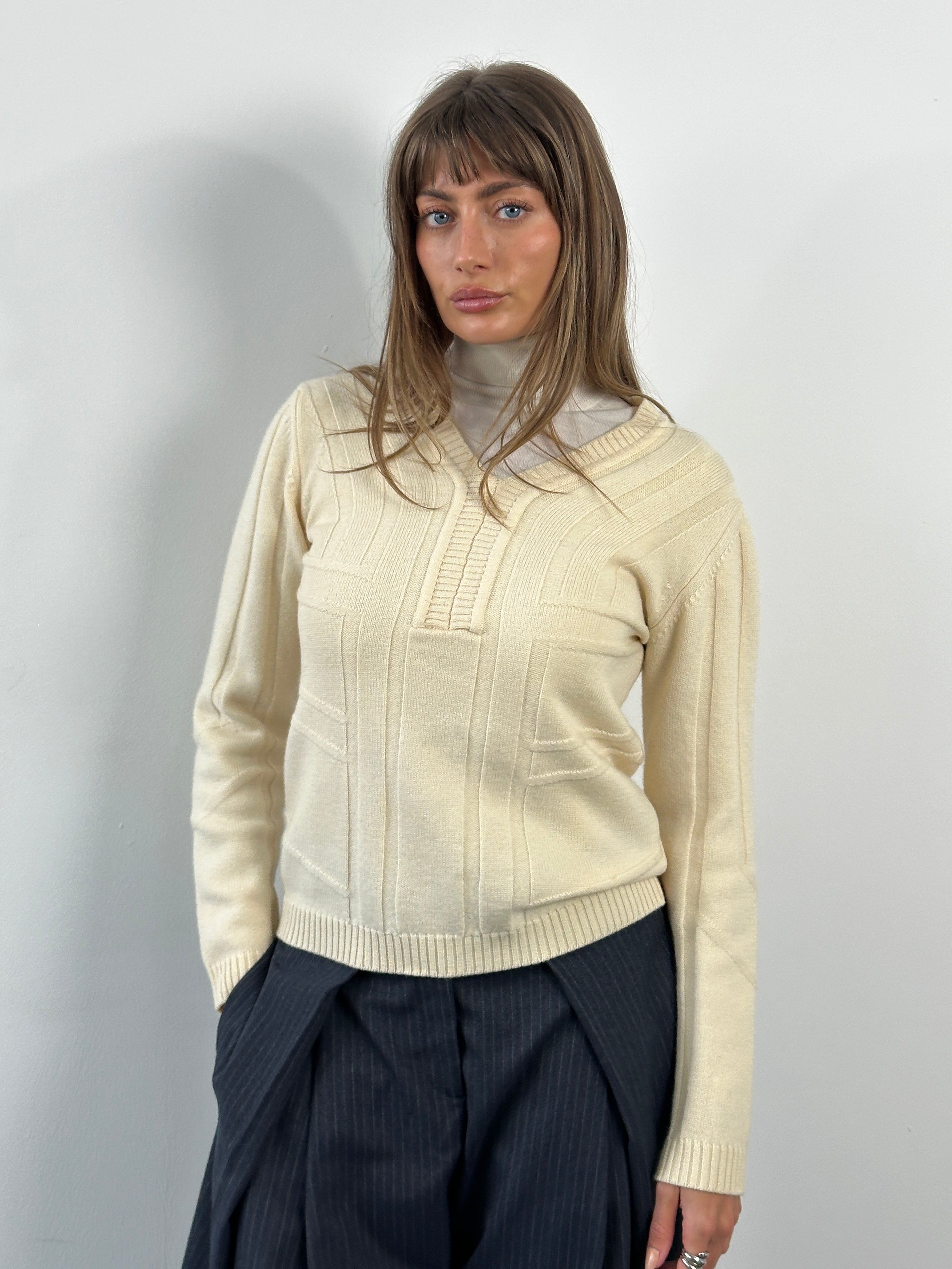 Versace Jeans Couture 2000s pure merino wool structured knit jumper in XS/S, shown in a close-up of the beige textured fabric.