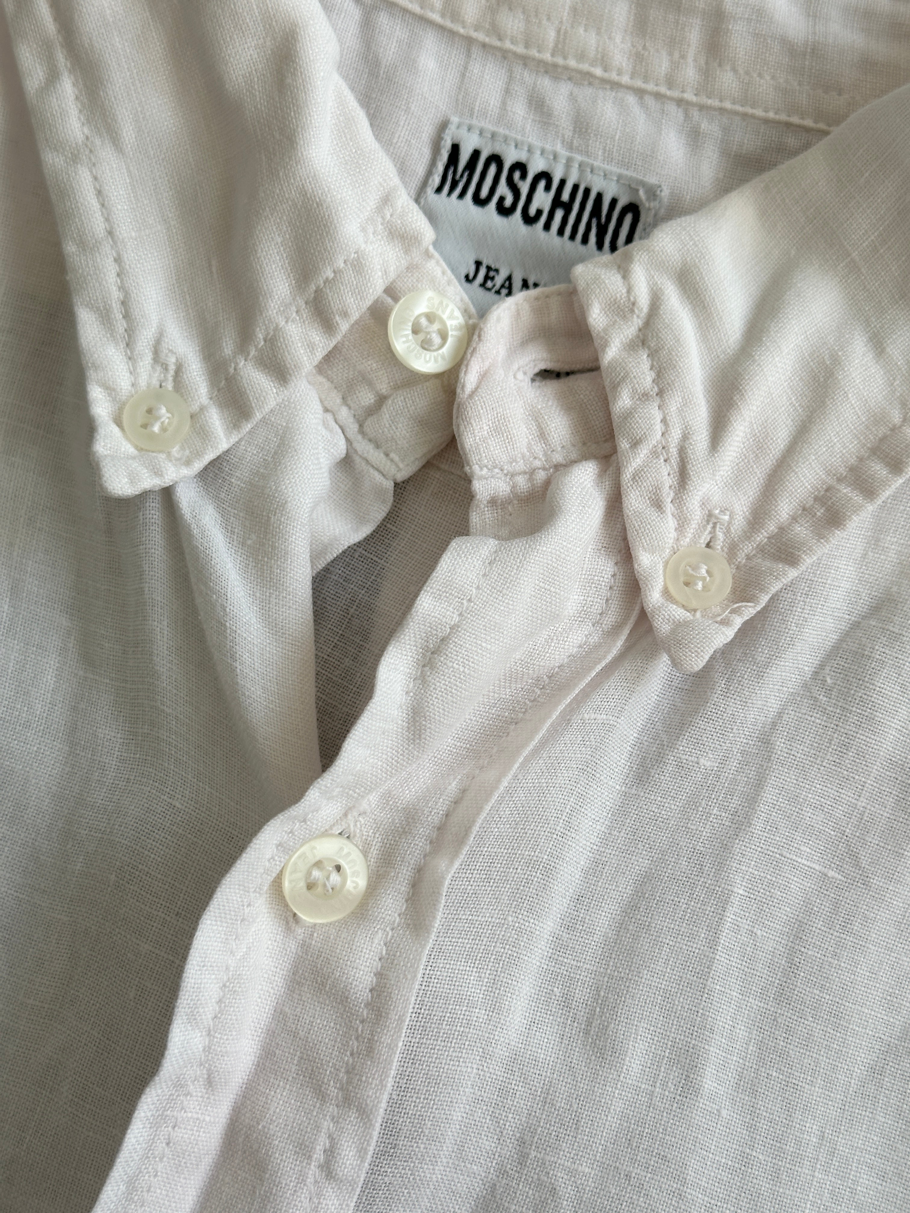Moschino pure linen logo short sleeve shirt in size L/XL, featuring a casual fit and stylish logo design.