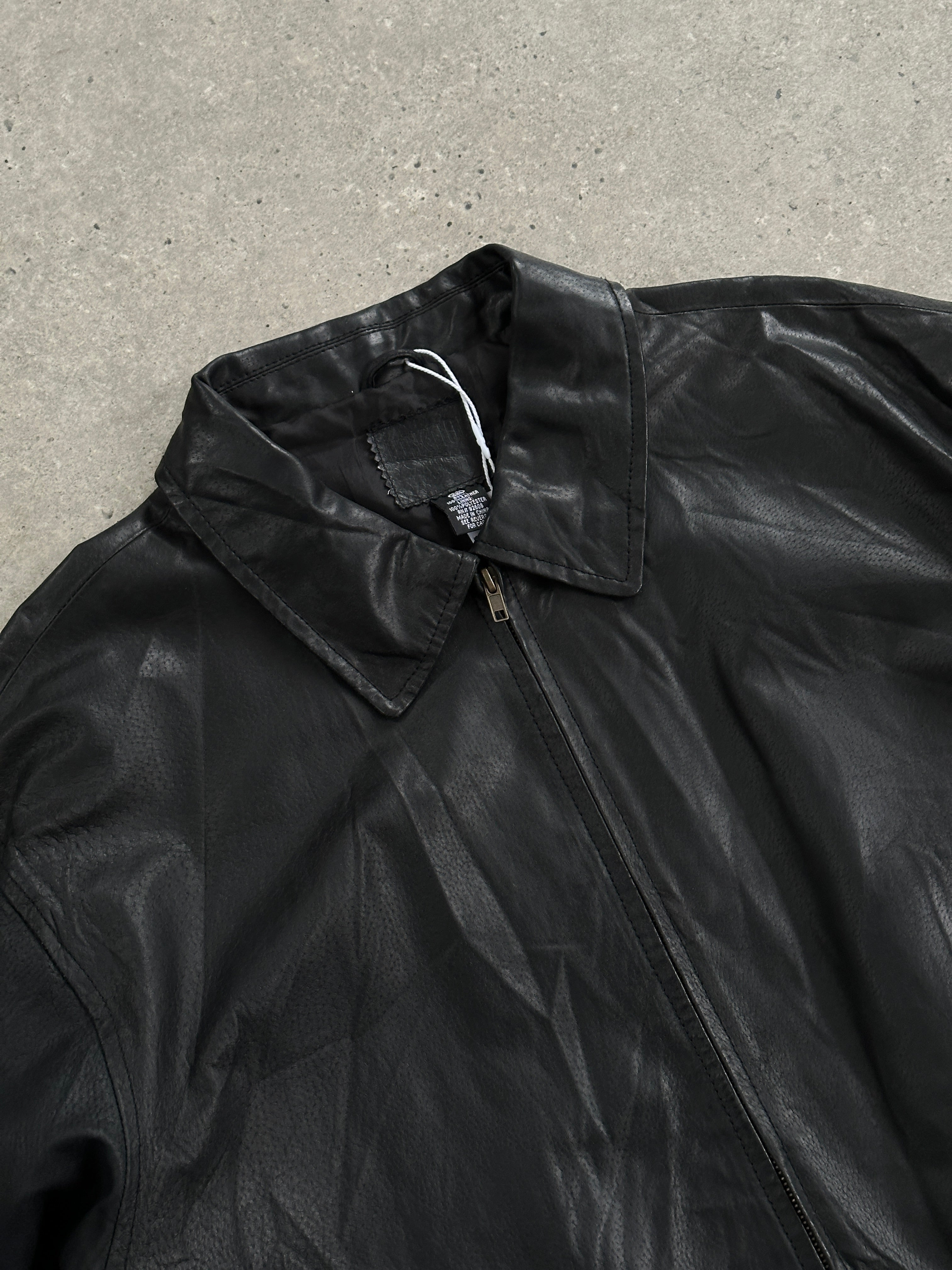 Vintage leather minimal bomber jacket in XL, featuring a sleek design with classic detailing and a smooth leather finish.