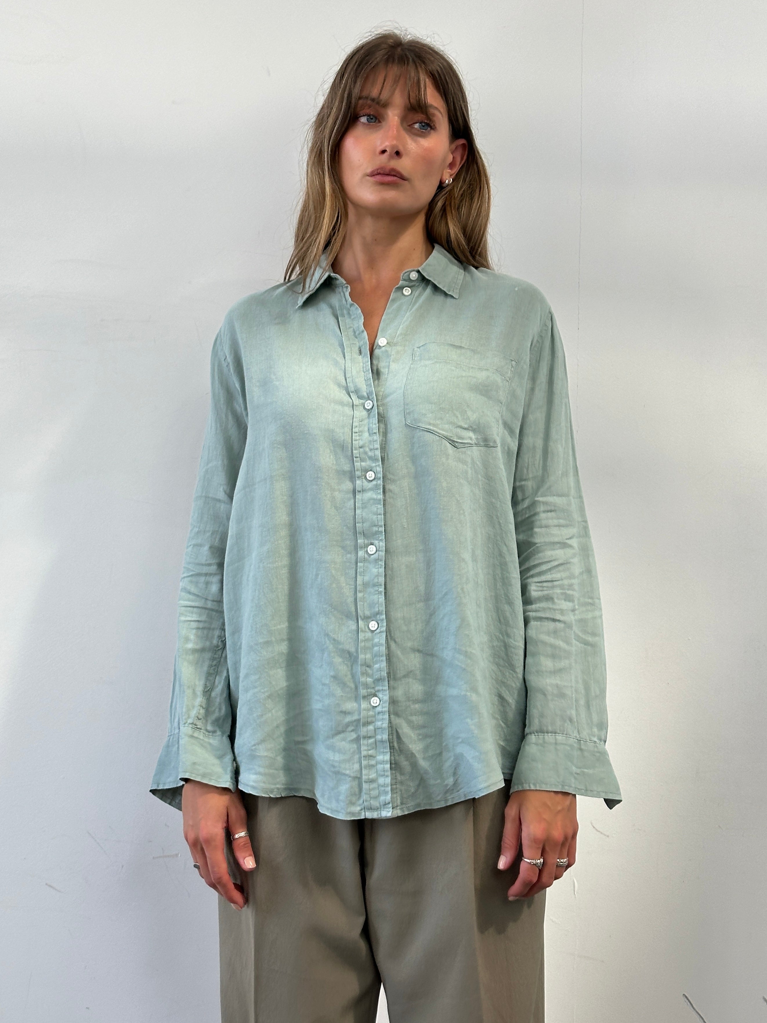 GAP relaxed pure linen shirt in size L, light beige color, casual fit, laid flat to showcase soft, breathable fabric and classic design.