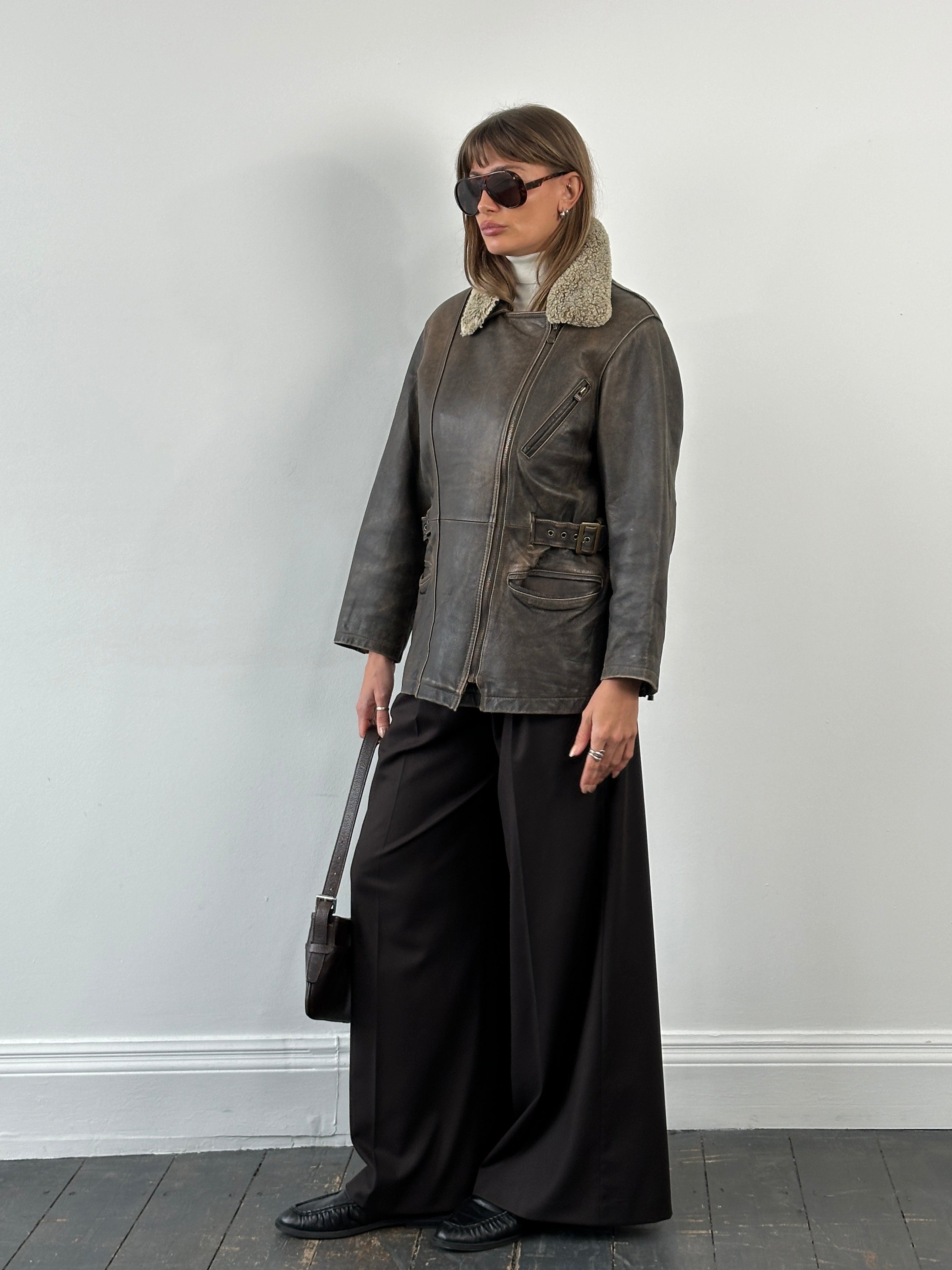 Vintage 1990s aged aviator leather jacket in size M, featuring classic design and distressed brown leather.