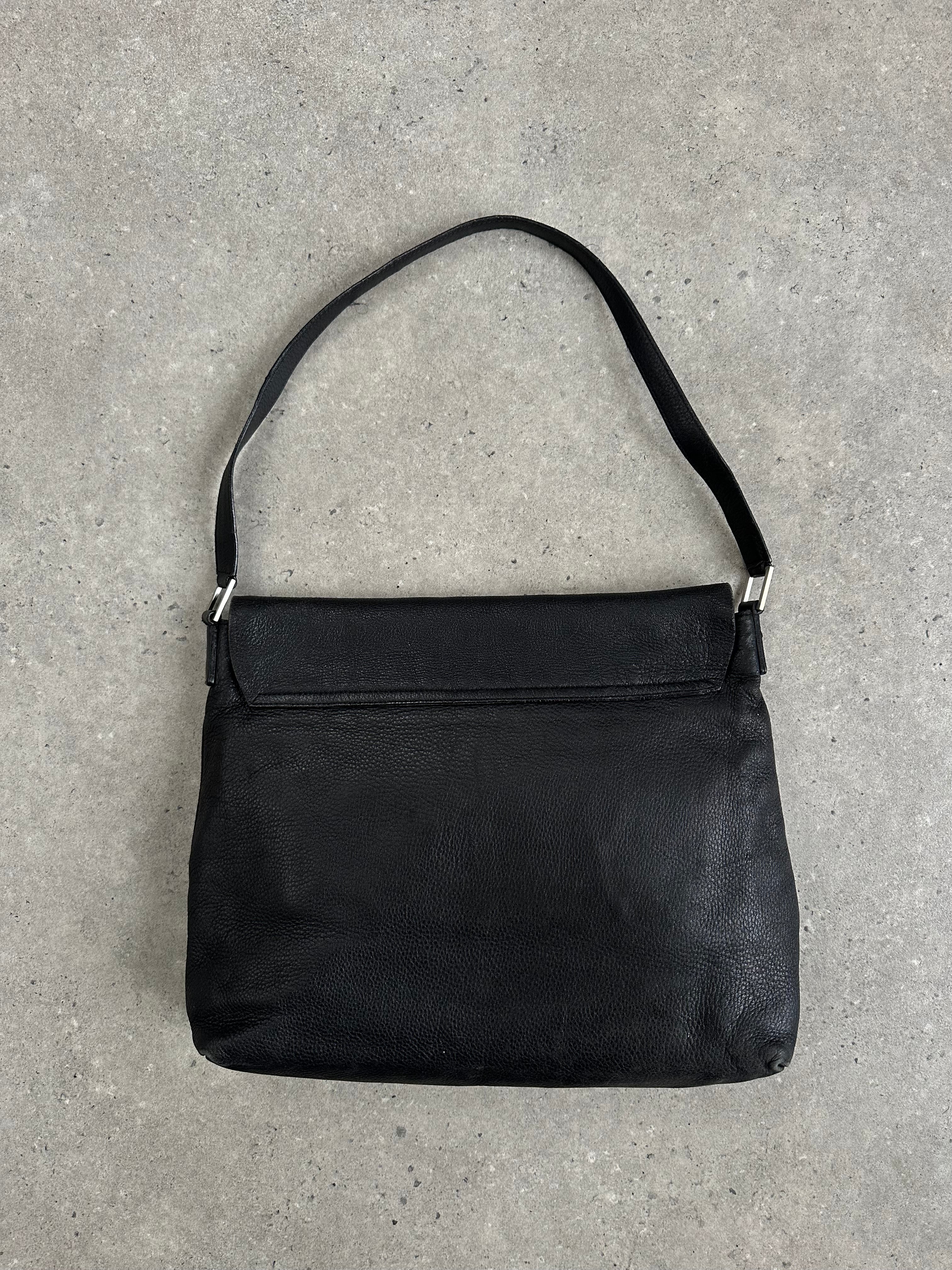 Giorgio Armani 2000s leather crossbody bag with adjustable strap and sleek design, showcasing classic luxury style.