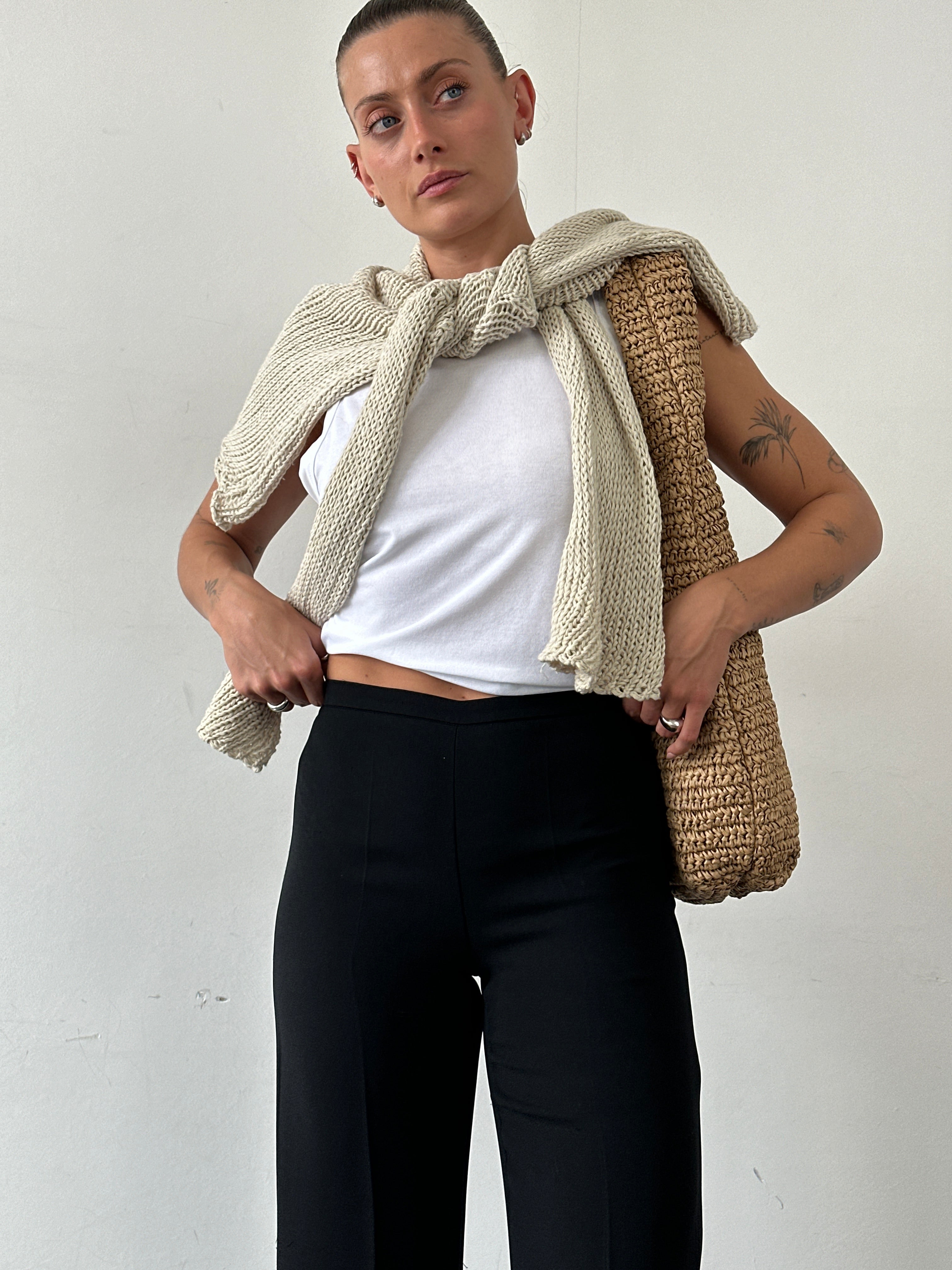 Marella minimal straight-leg mid-waist trousers in neutral fabric, shown on a model with a close-up of the fit and design details.