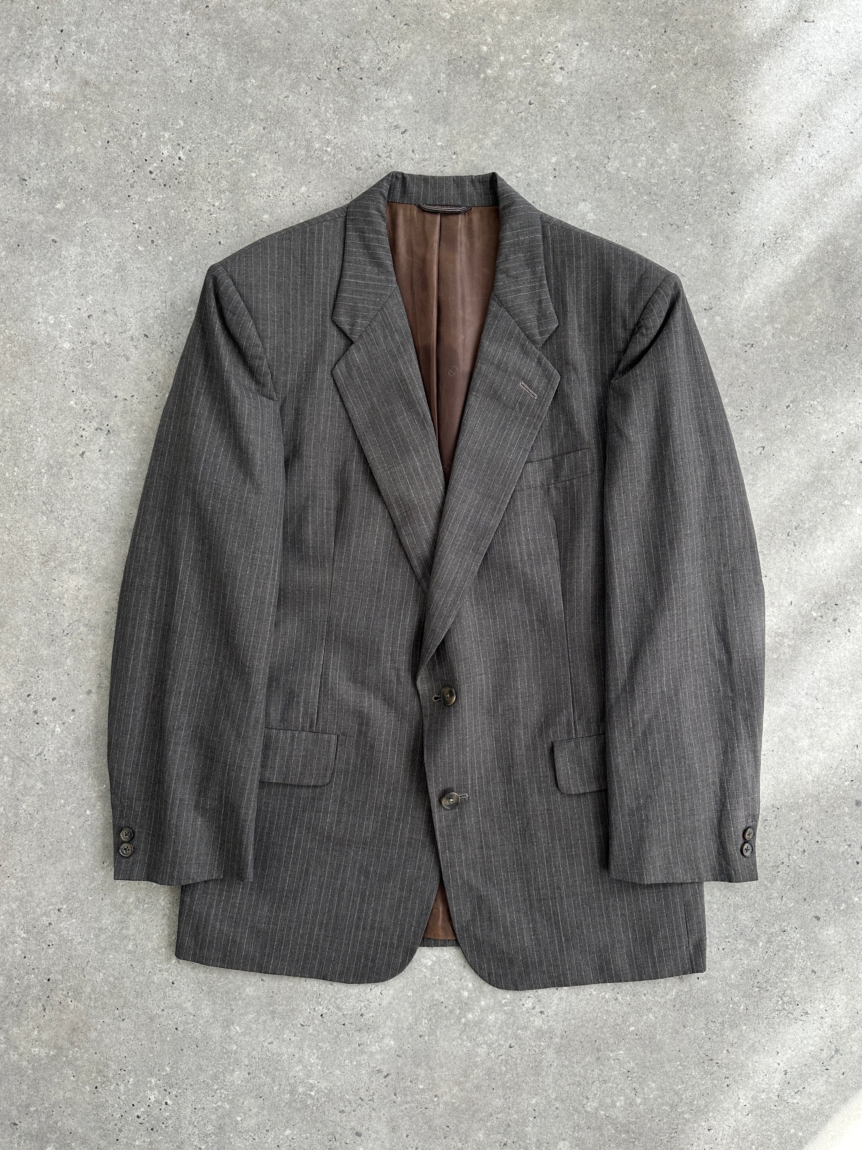 Christian Dior Monsieur 1990s stripe wool blazer in size 40R/M, featuring classic tailored fit and bold stripe pattern.