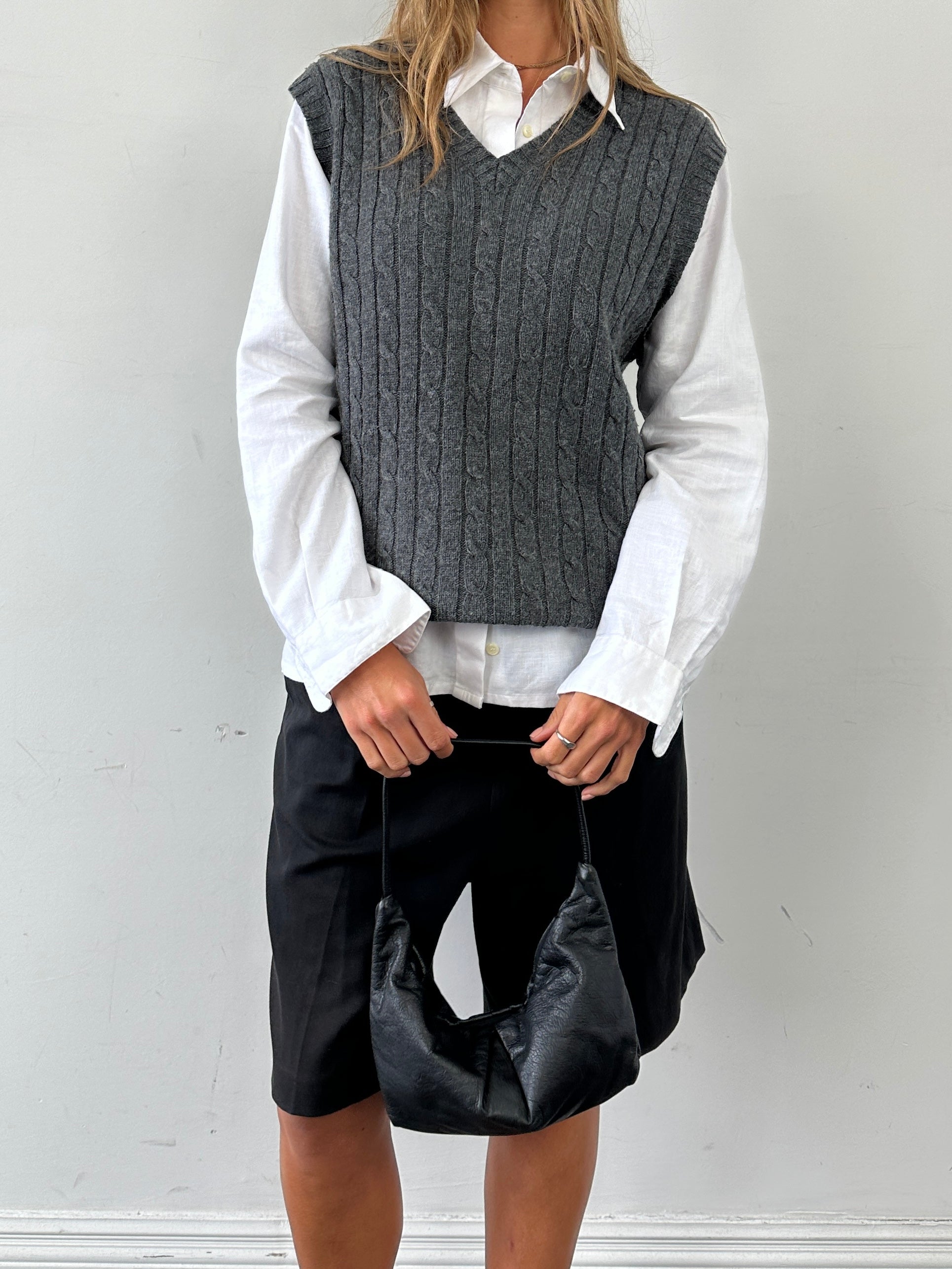 L.L.Bean lambswool cable knit sleeveless vest jumper in size L/XL, featuring a textured cable pattern and classic design.