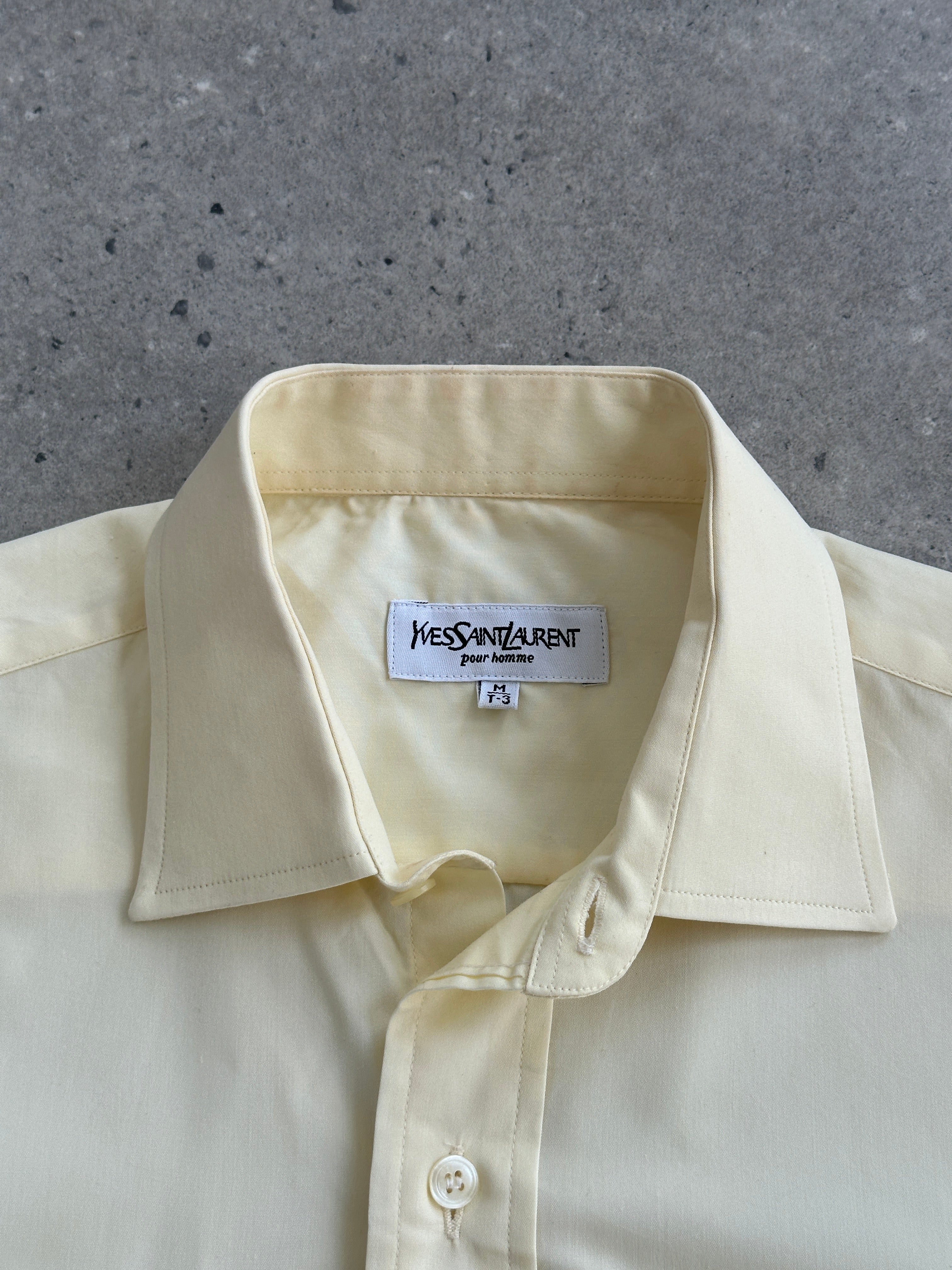 Yves Saint Laurent Pour Homme 1990s cotton short sleeve logo shirt in size L, featuring the classic YSL logo on the front.