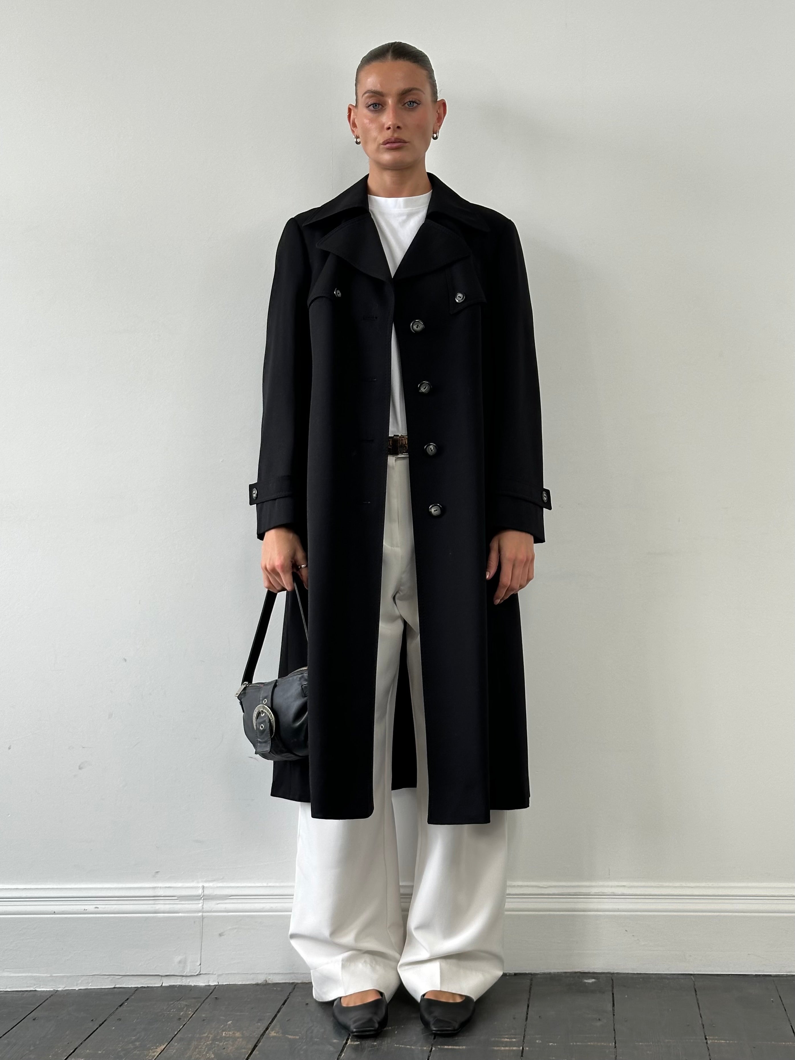 Vintage pure wool single-breasted belted trench coat in neutral color, displayed on a hanger.