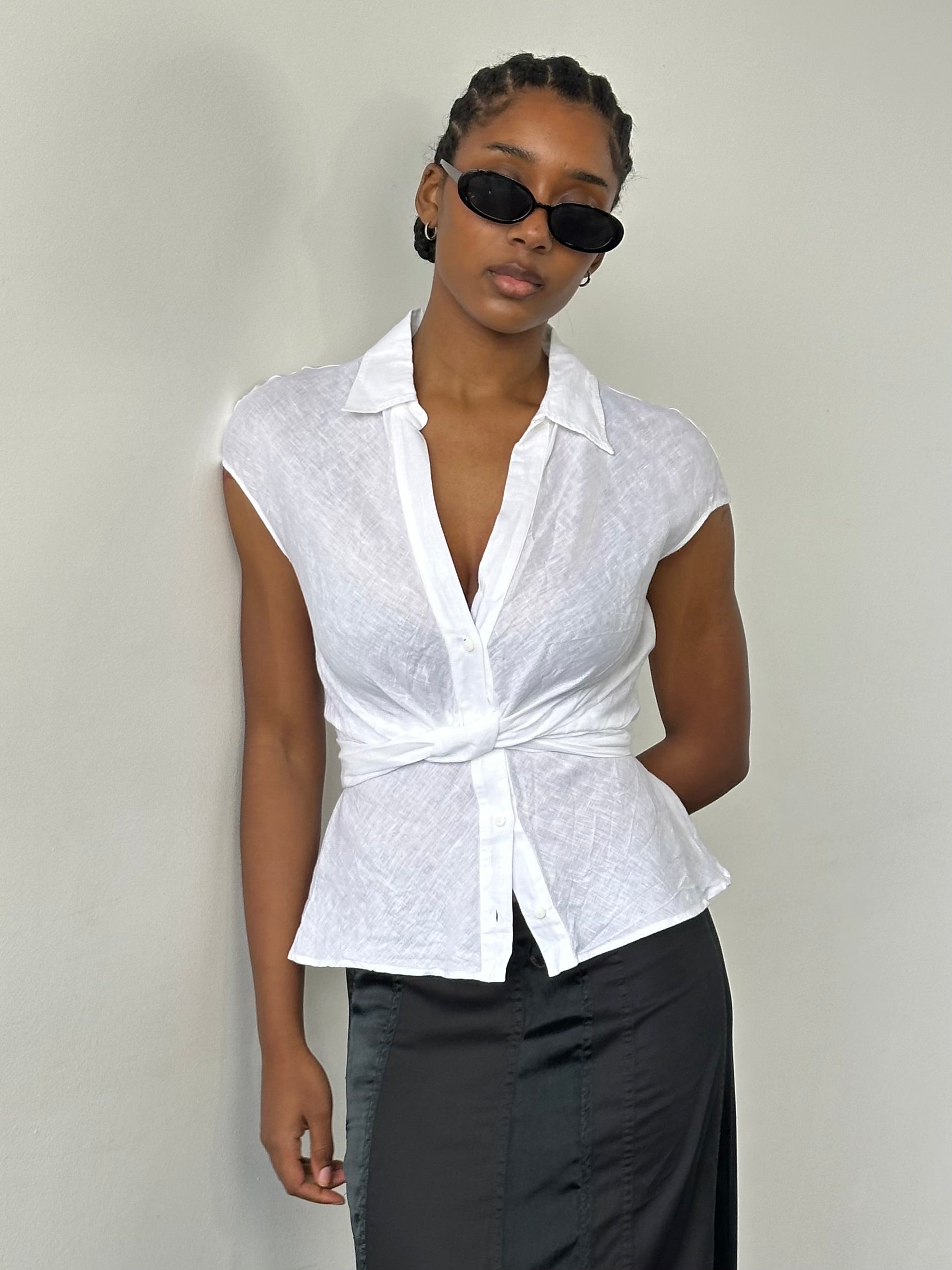 Max Mara 2000s pure linen sleeveless wrap shirt in size S/M, showcasing a lightweight, stylish design with a tied front.