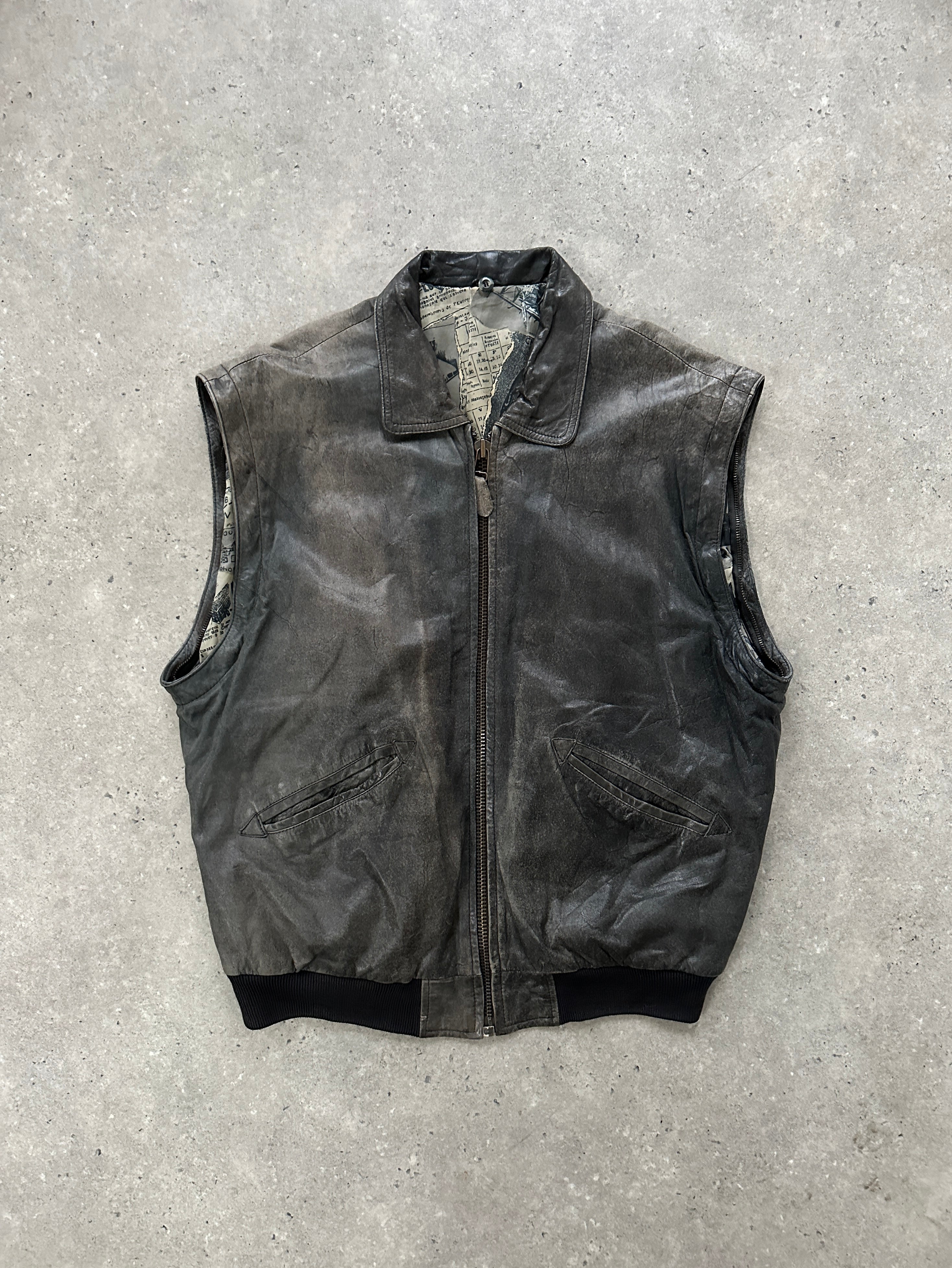 Vintage distressed leather bomber jacket in size L/XL displayed on a hanger, showcasing its rugged texture and classic fit.