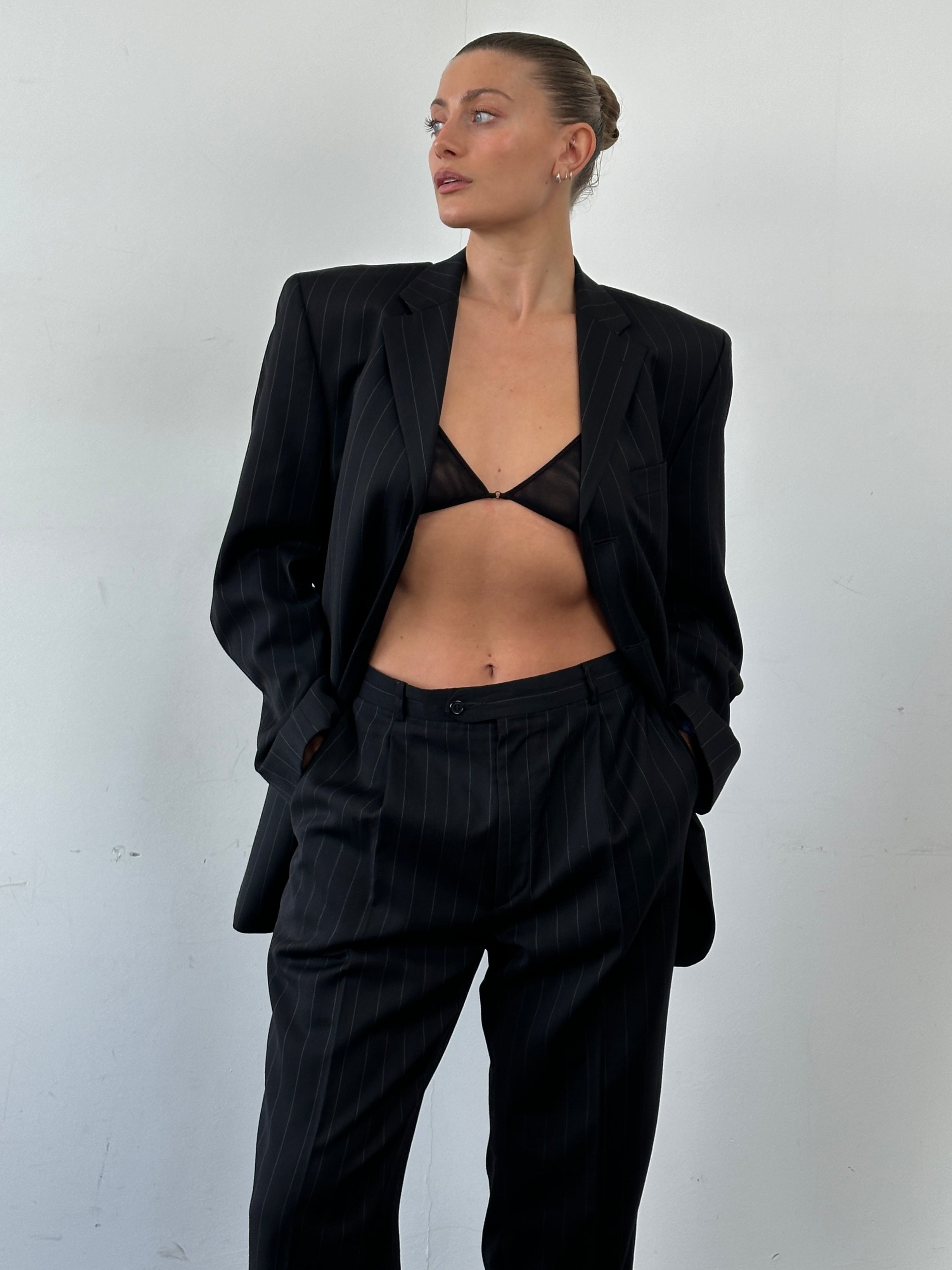 Vintage pure wool pinstripe jumpsuit with single breasted design in size 40R/W34, featuring classic tailored details.
