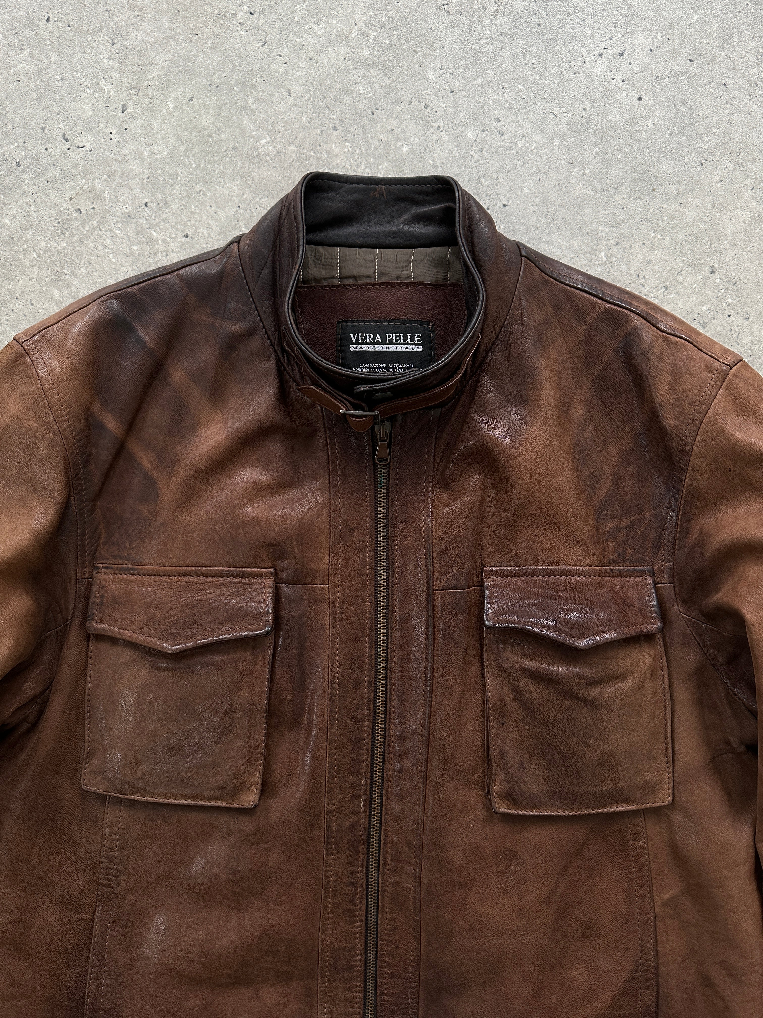 Vintage Italian aged leather jacket in size large, featuring rugged texture and classic design.