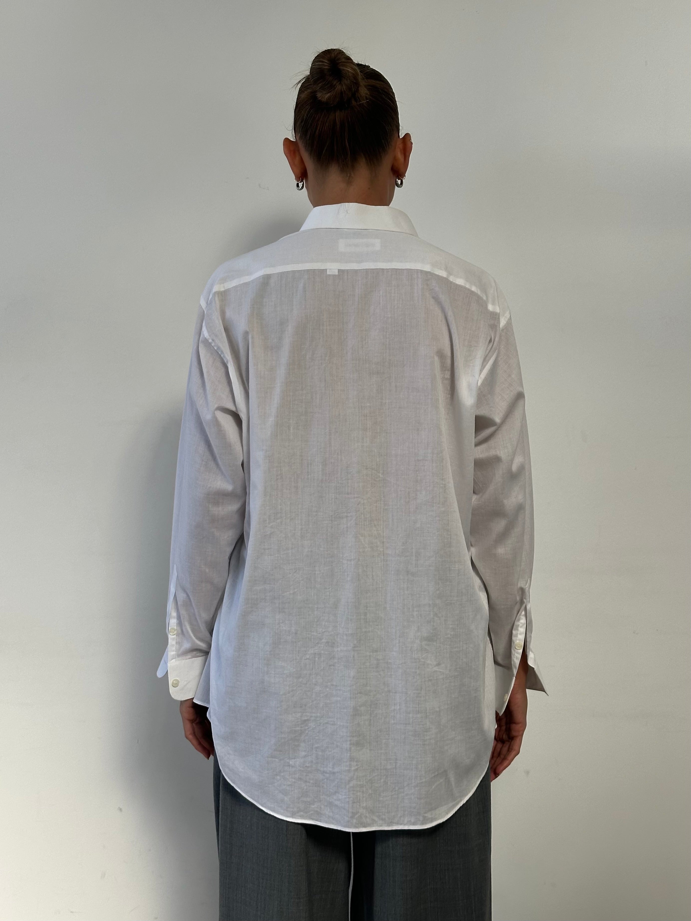 Yves Saint Laurent 90s cotton logo shirt in size L/XL with classic YSL branding and relaxed fit, displayed on a hanger.