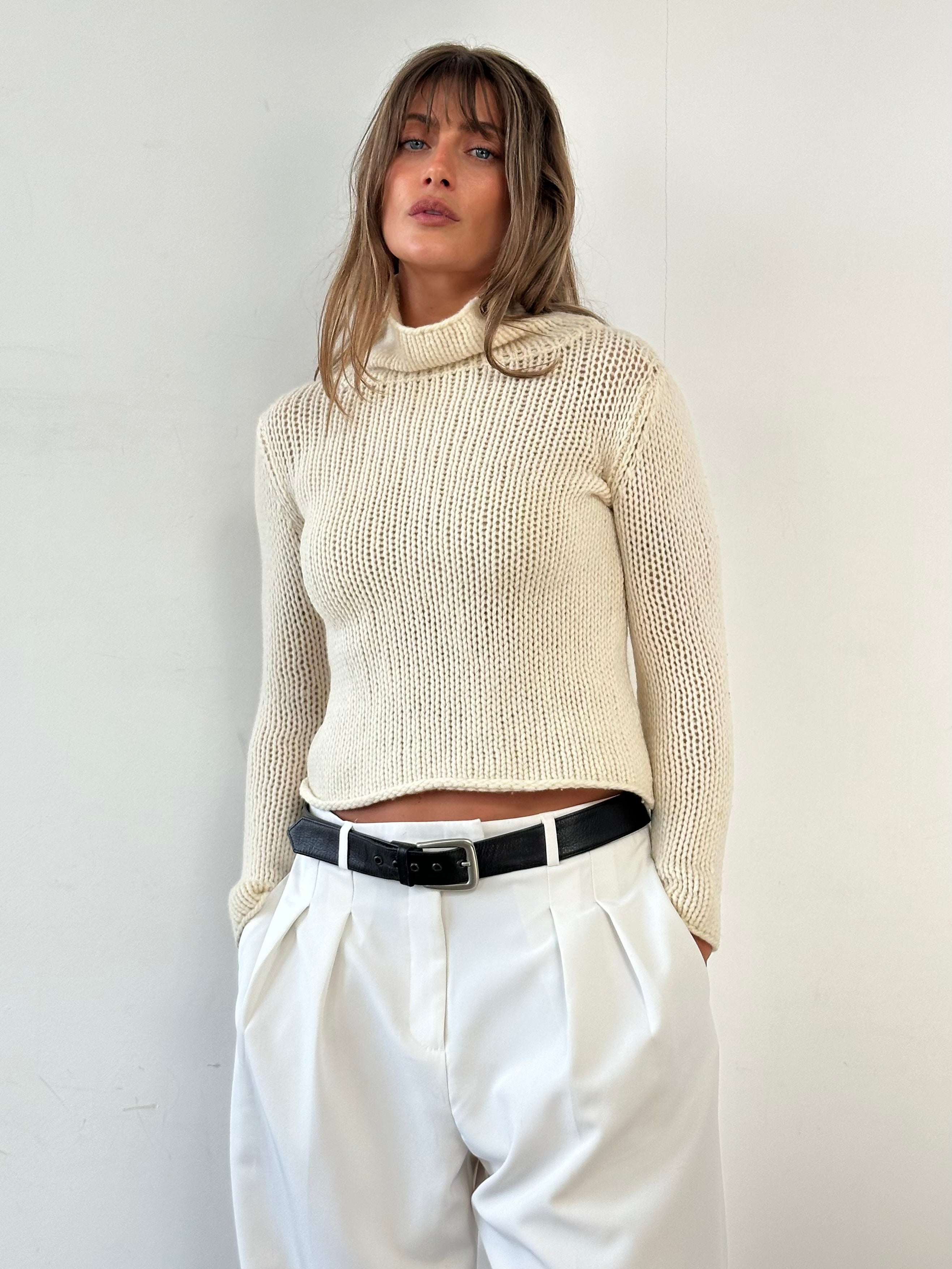 Max Mara Weekend wool knitted crop roll neck jumper in beige, featuring a fitted design and ribbed cuffs.
