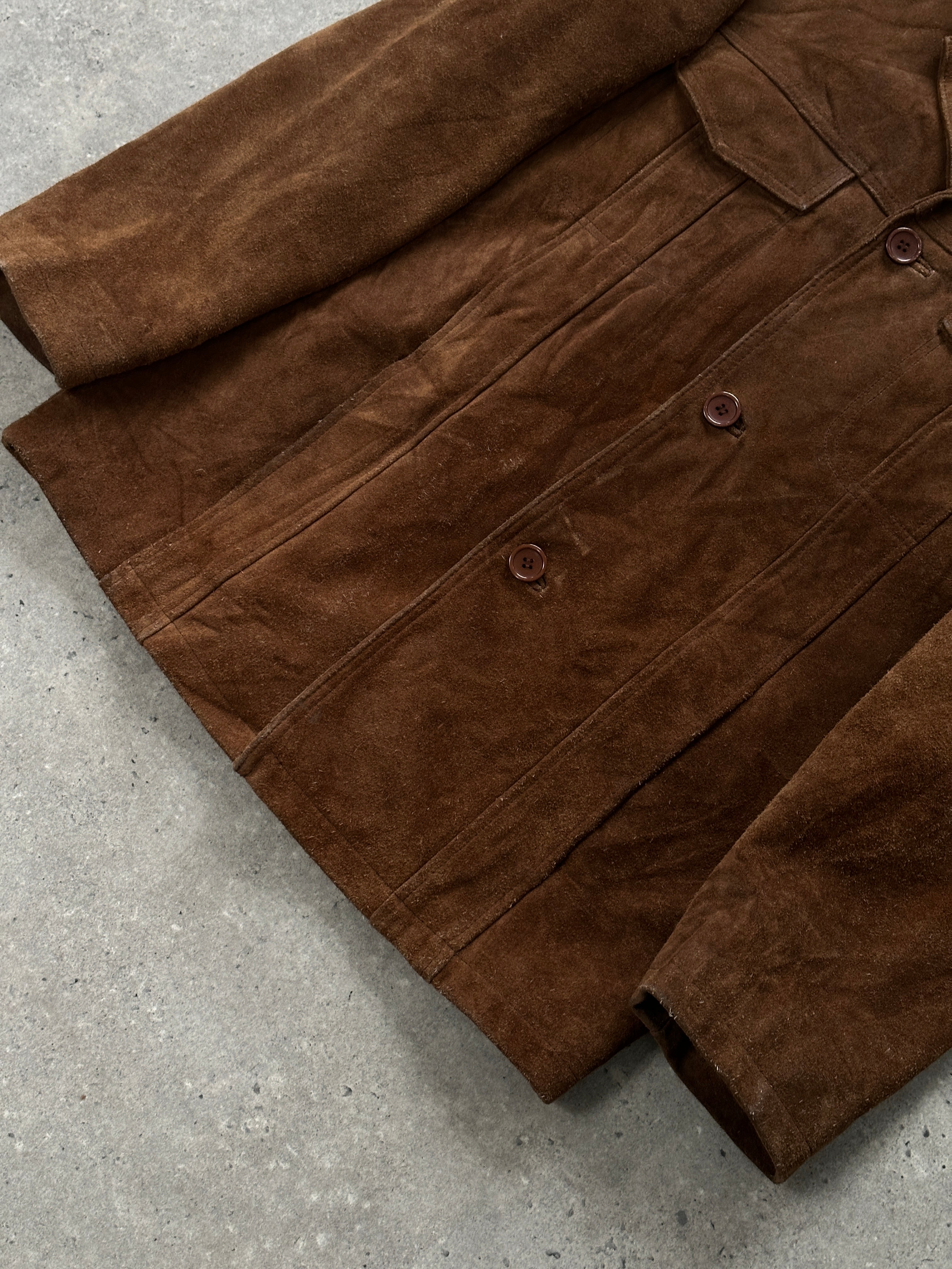 Vintage 1990s suede leather jacket in size L, stylish and classic, displayed on a hanger with a rugged texture.