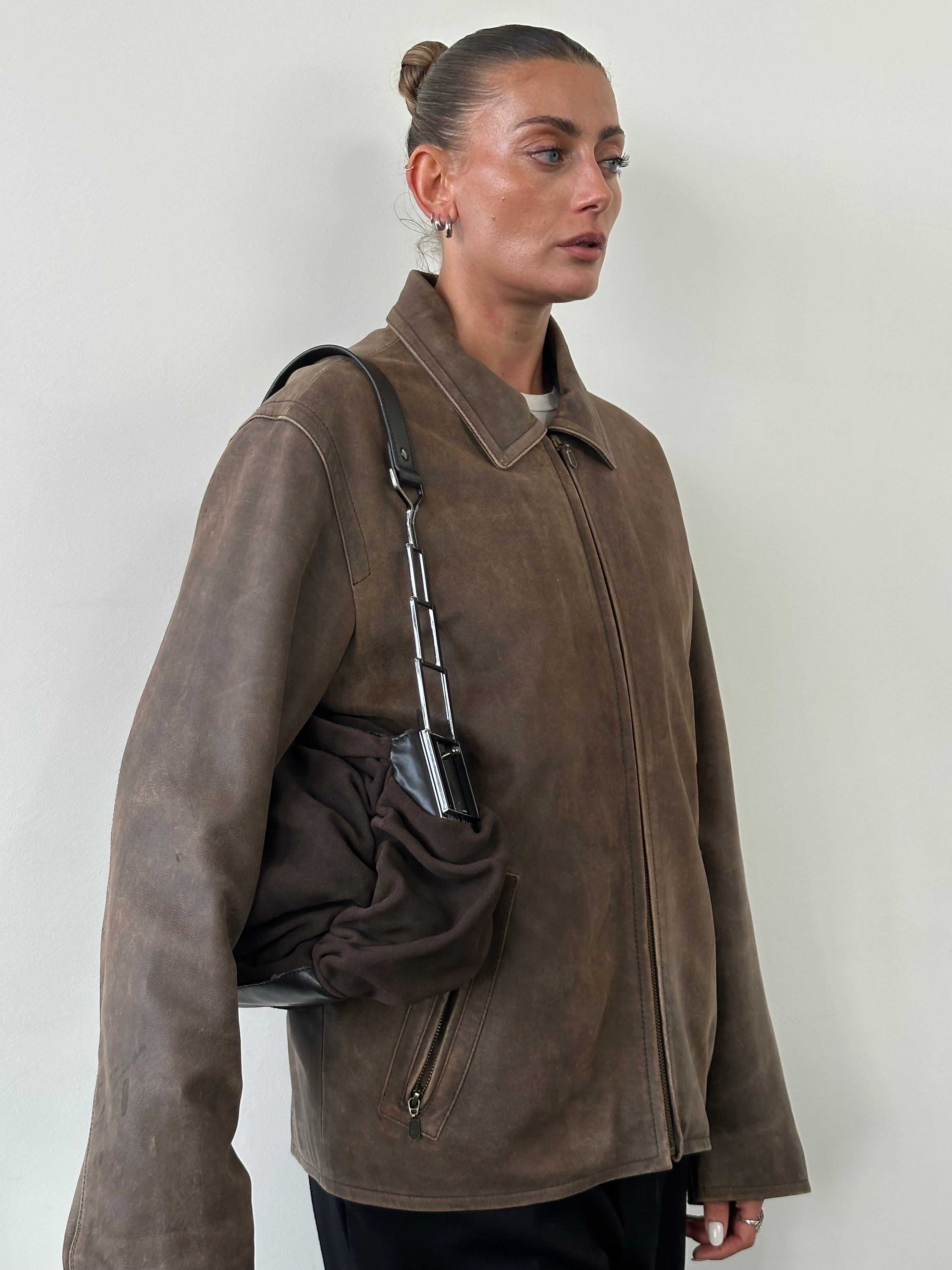 Vintage distressed leather jacket in size large, featuring a rugged, worn-in look and classic leather texture.