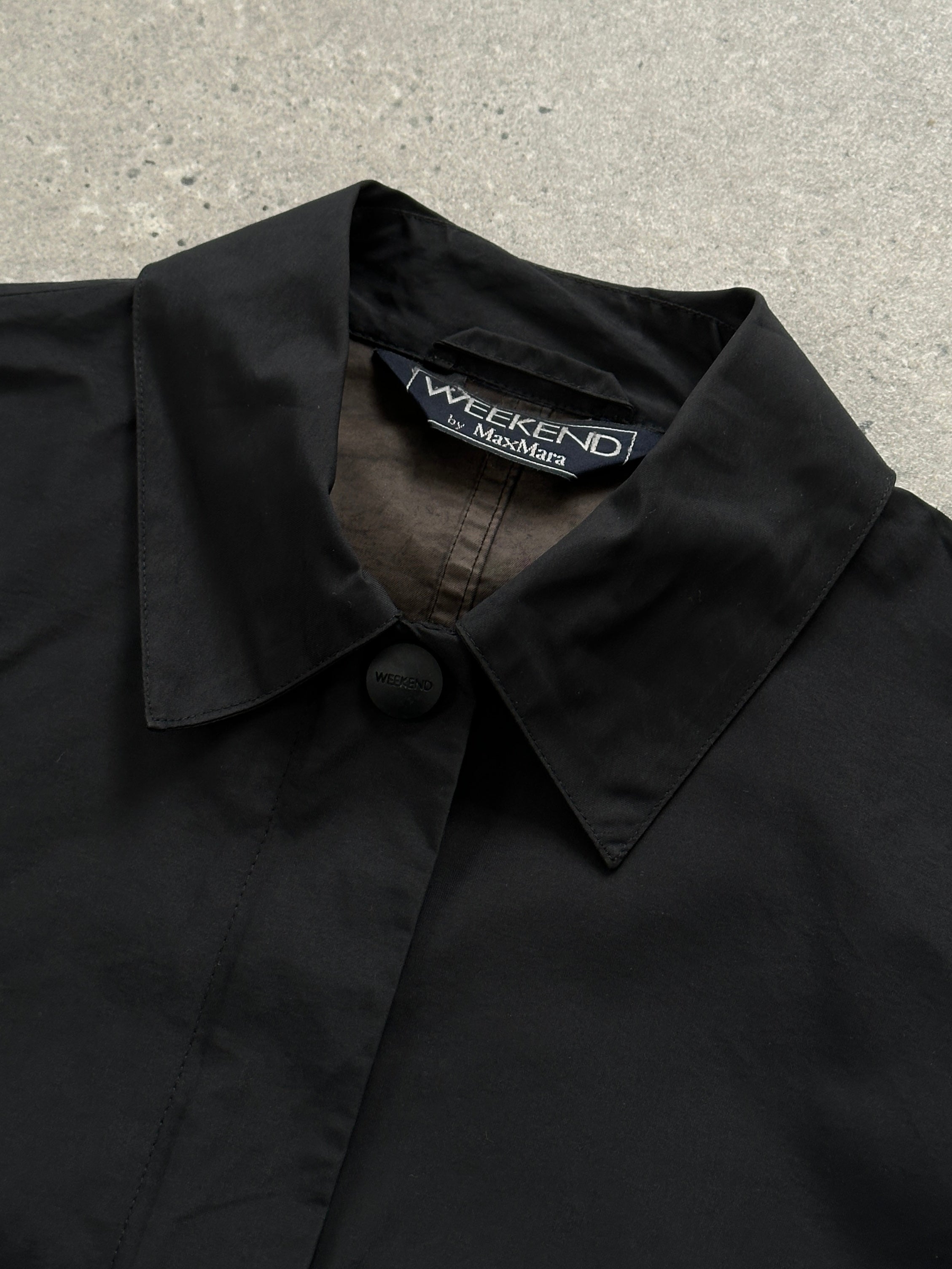 Max Mara Weekend concealed placket bomber jacket in size M, black with ribbed cuffs and collar, front zipper closure.