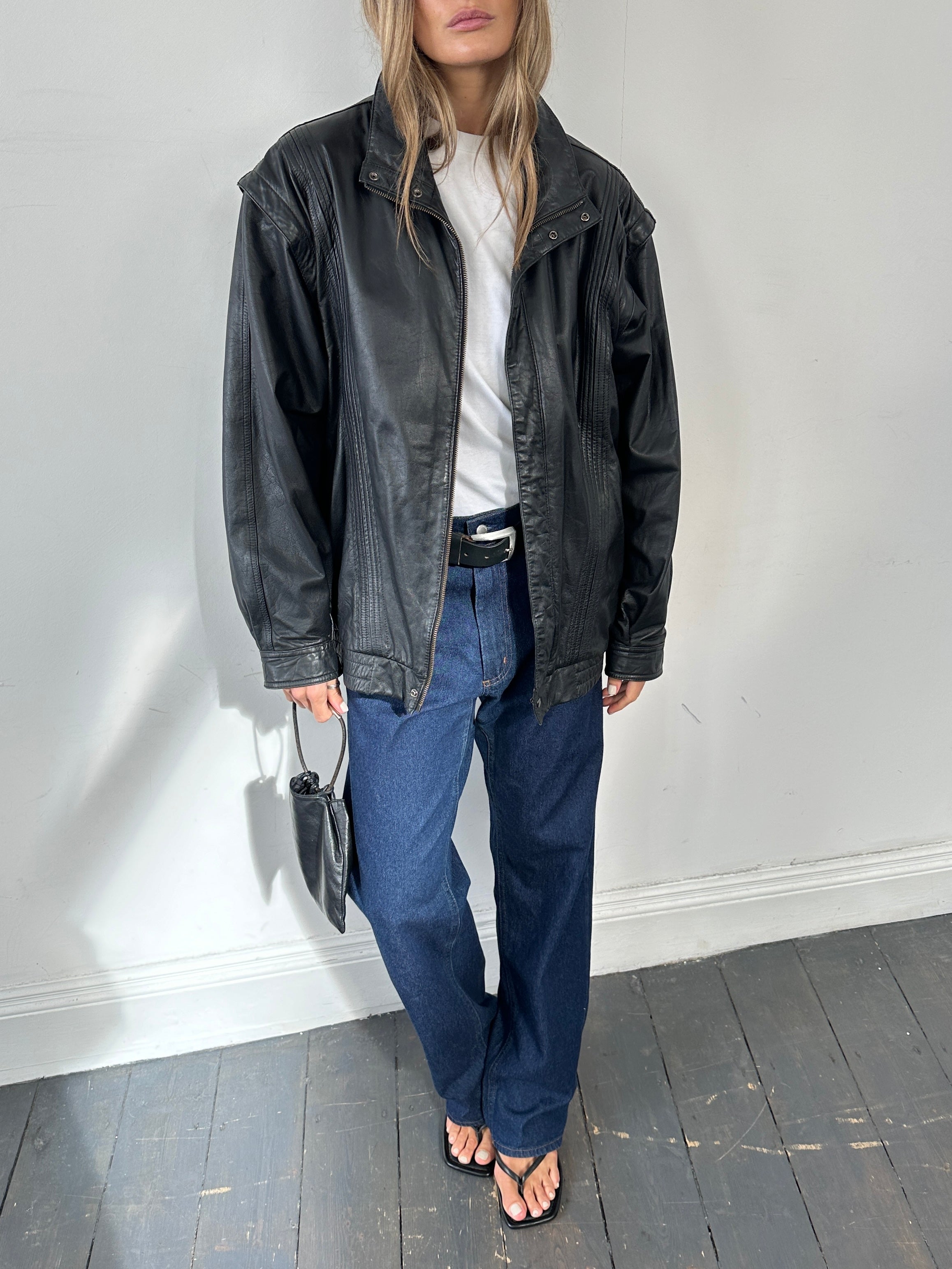 Vintage leather bomber gilet jacket in XL, featuring classic design with a smooth leather finish and ribbed collar.