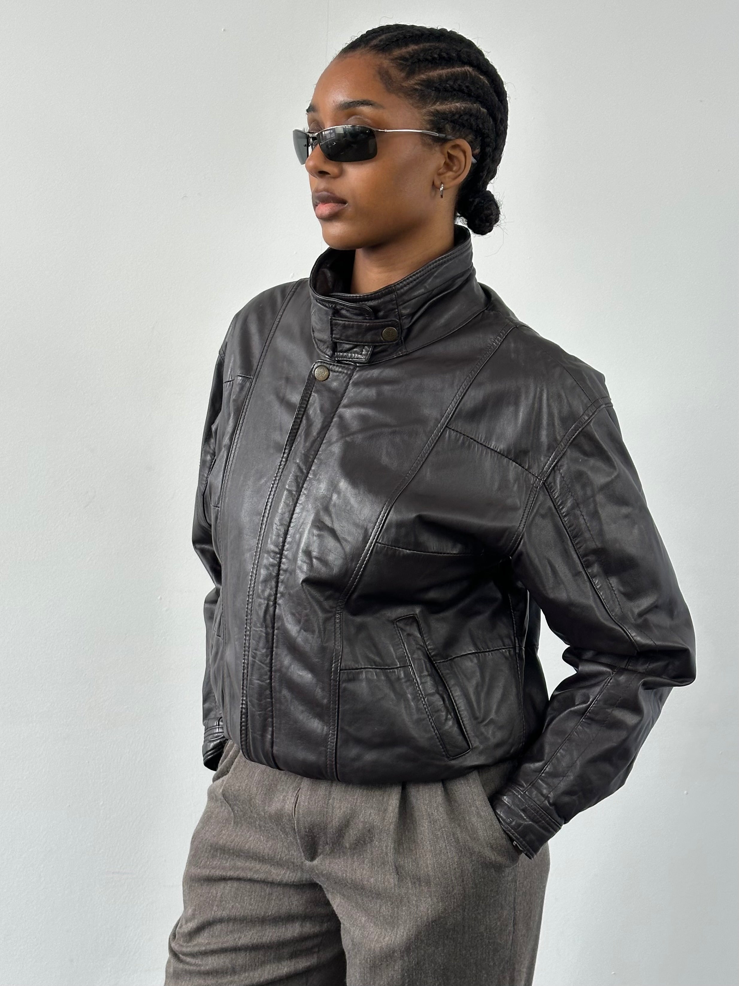Valentino 1990s high neck leather bomber jacket in black, featuring a sleek design and classic silhouette.