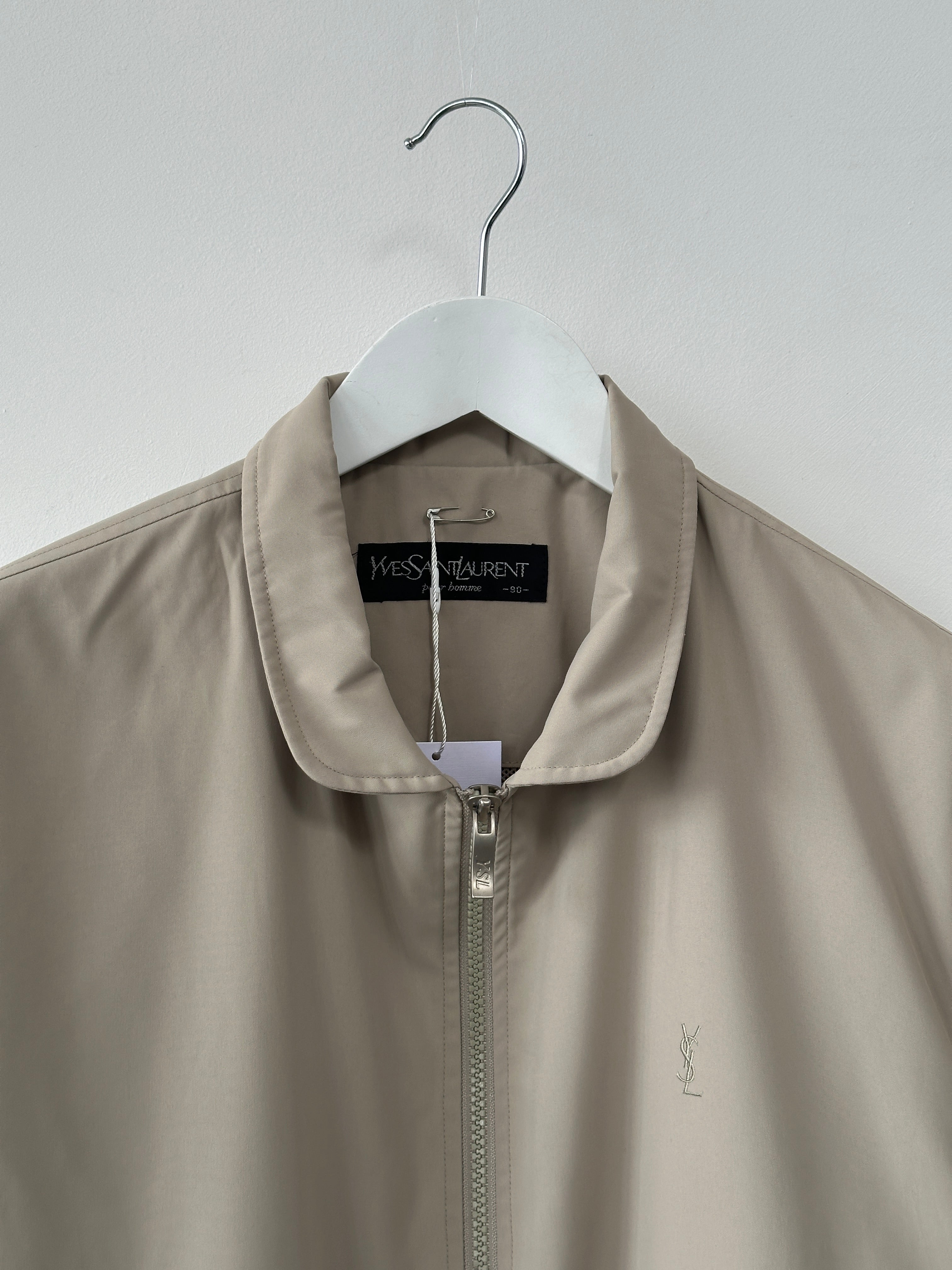 Yves Saint Laurent Pour Homme logo bomber jacket in black, men's size M, stylish casual jacket with YSL branding visible.