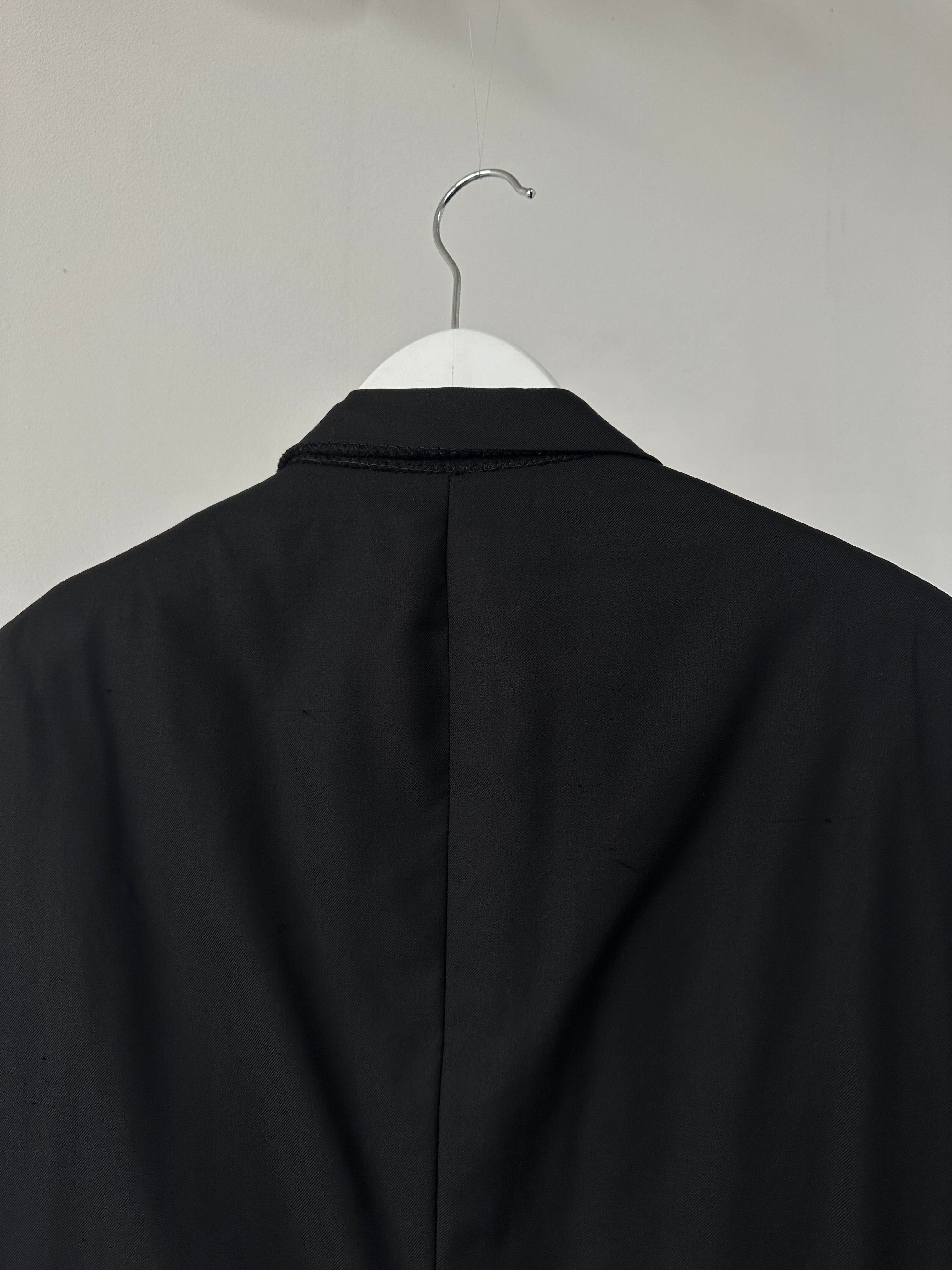 Christian Dior pure wool double-breasted blazer in size L/XL, tailored fit with classic lapels and button details.