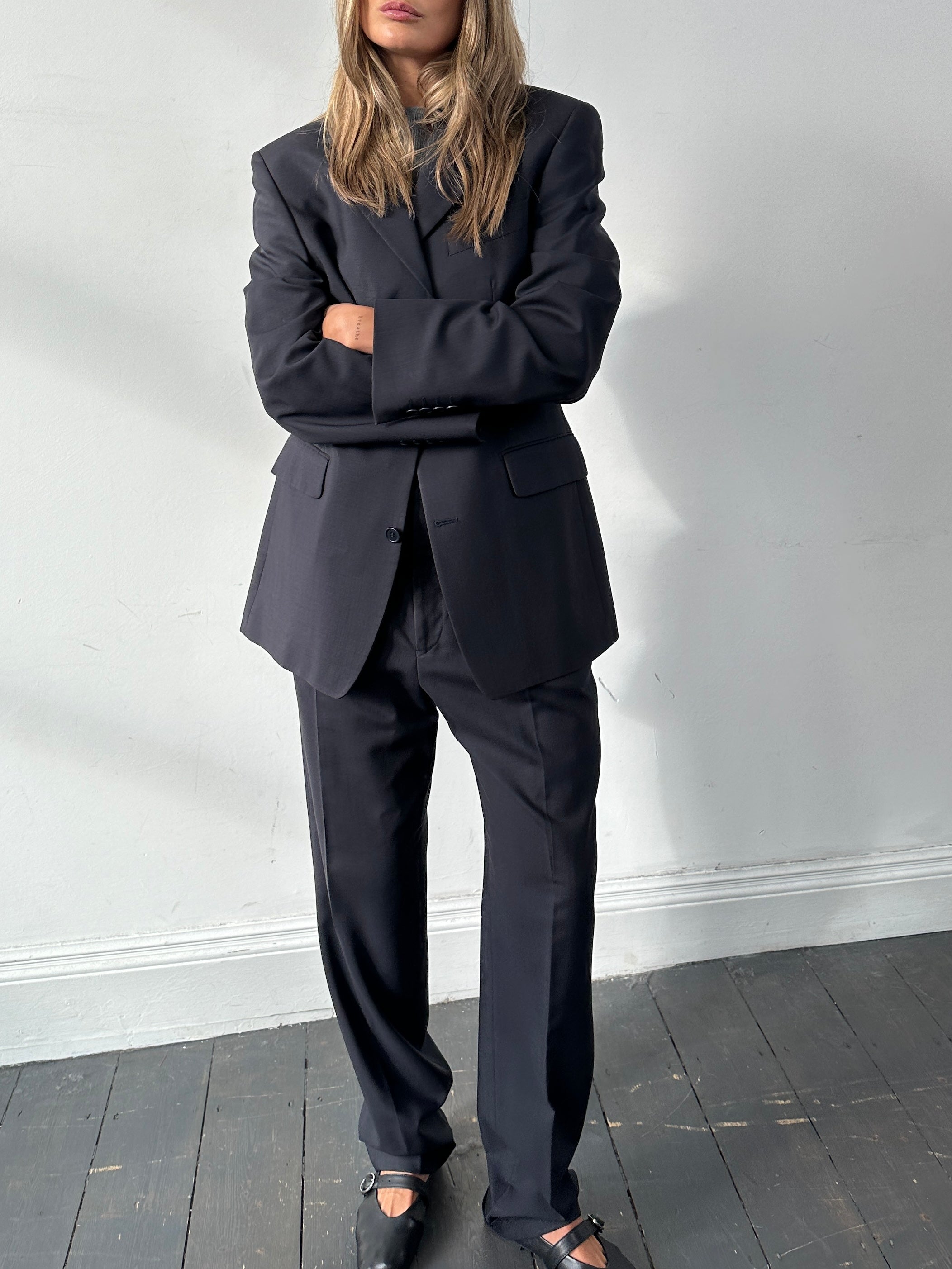 Yves Saint Laurent Pour Homme wool single-breasted jumpsuit in size 38R/W30, tailored fit, dark fabric, front buttons, and classic lapel.
