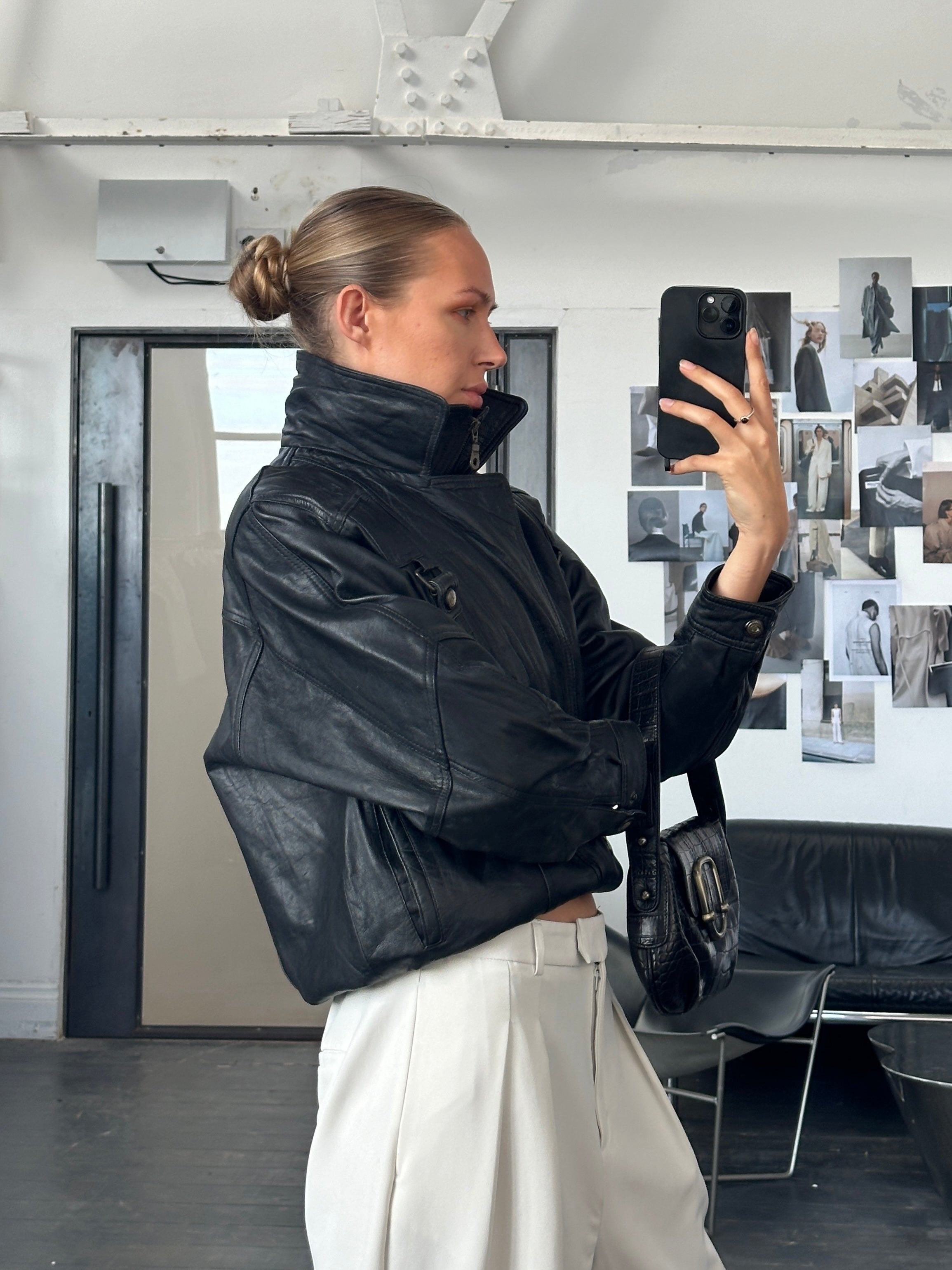Vintage 1990s high neck leather bomber jacket in size M, classic style with a rugged leather finish and vintage detailing.