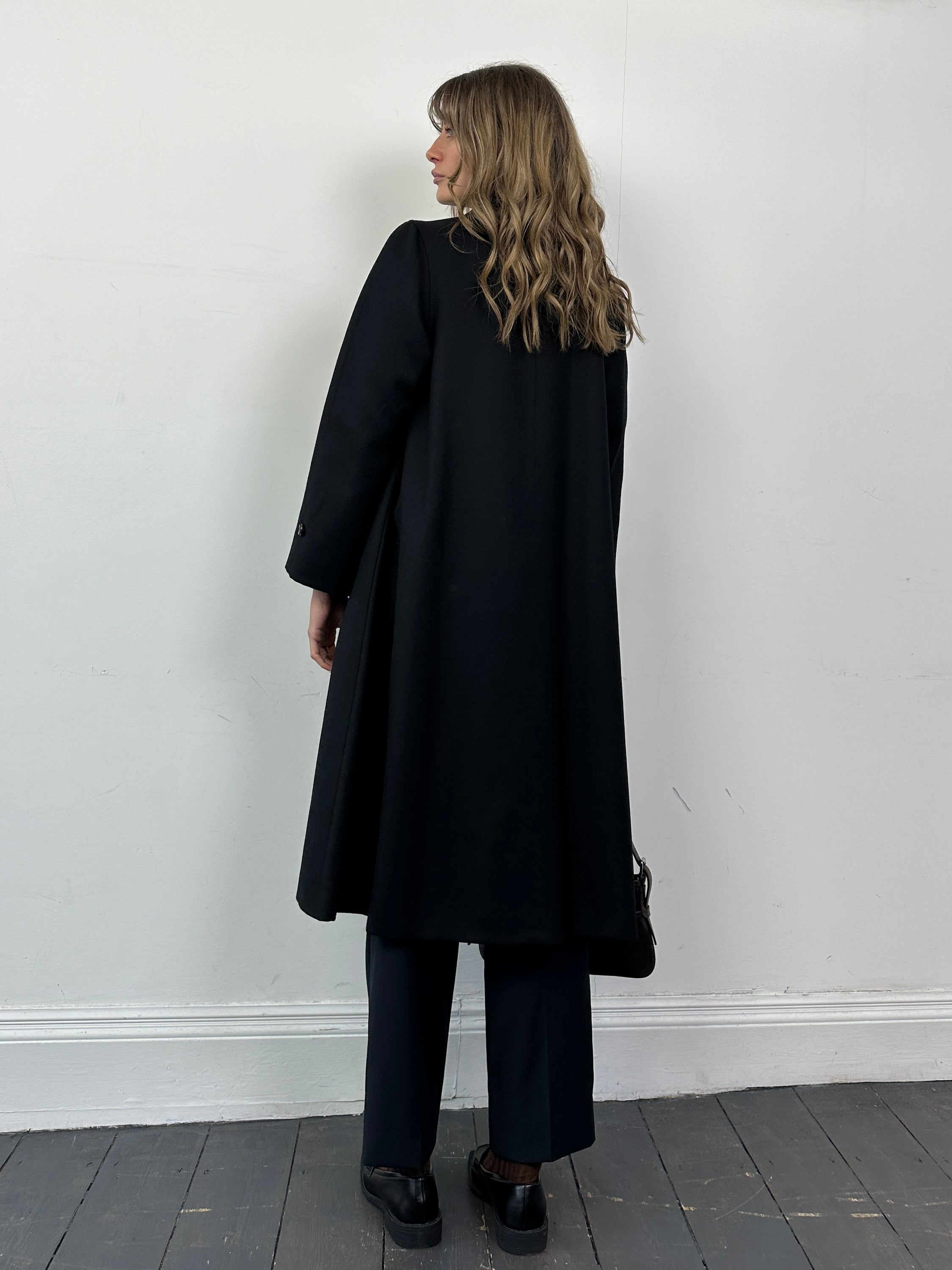 Vintage pure wool single-breasted A-line coat in size S, displayed on a mannequin with a classic collar and tailored fit.