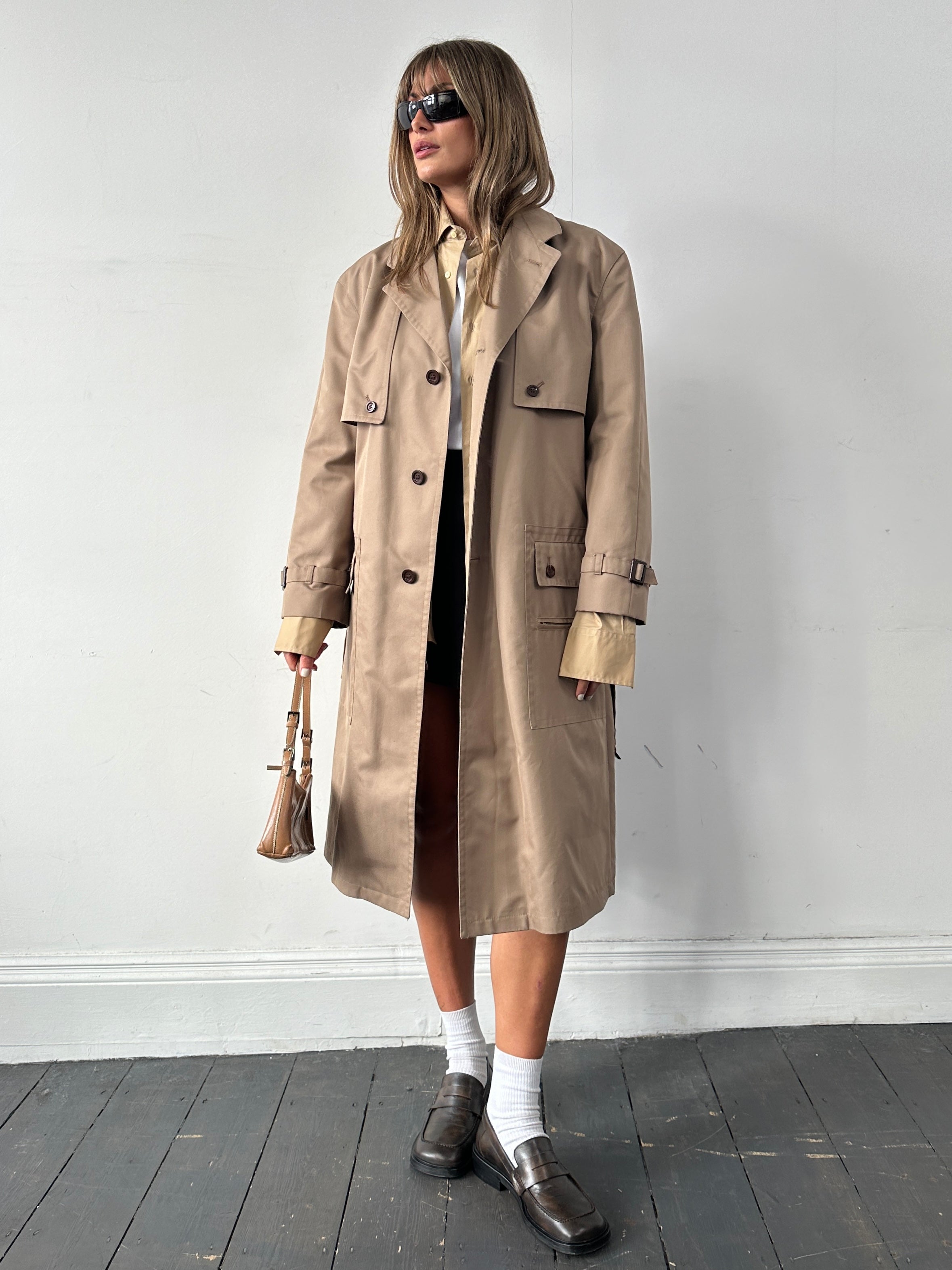 Vintage cotton single-breasted belted trench coat in XL size, featuring classic design and timeless style.