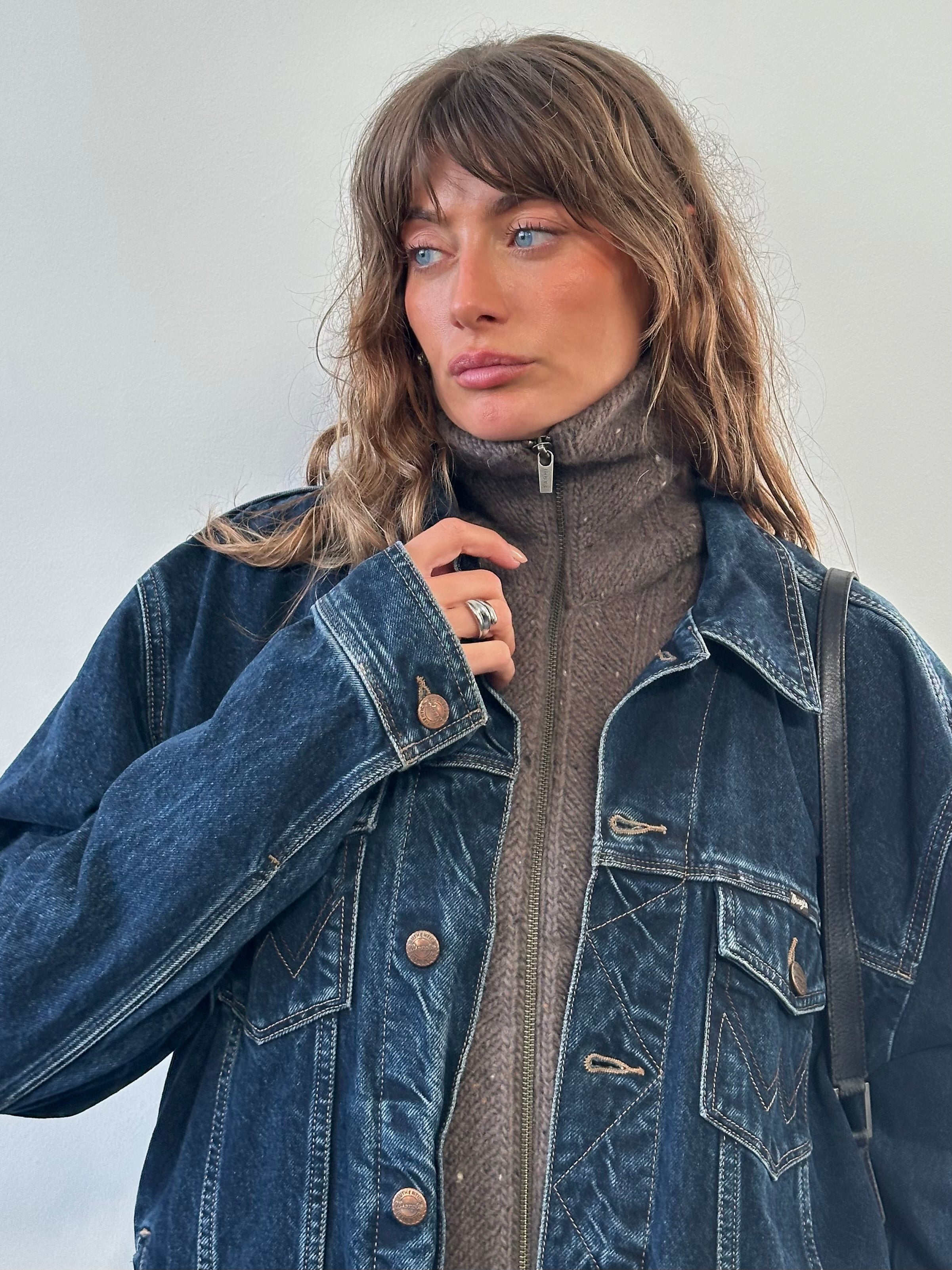 Wrangler 1990s mid wash denim jacket in XL, featuring classic style, button-up front, and rugged denim fabric.