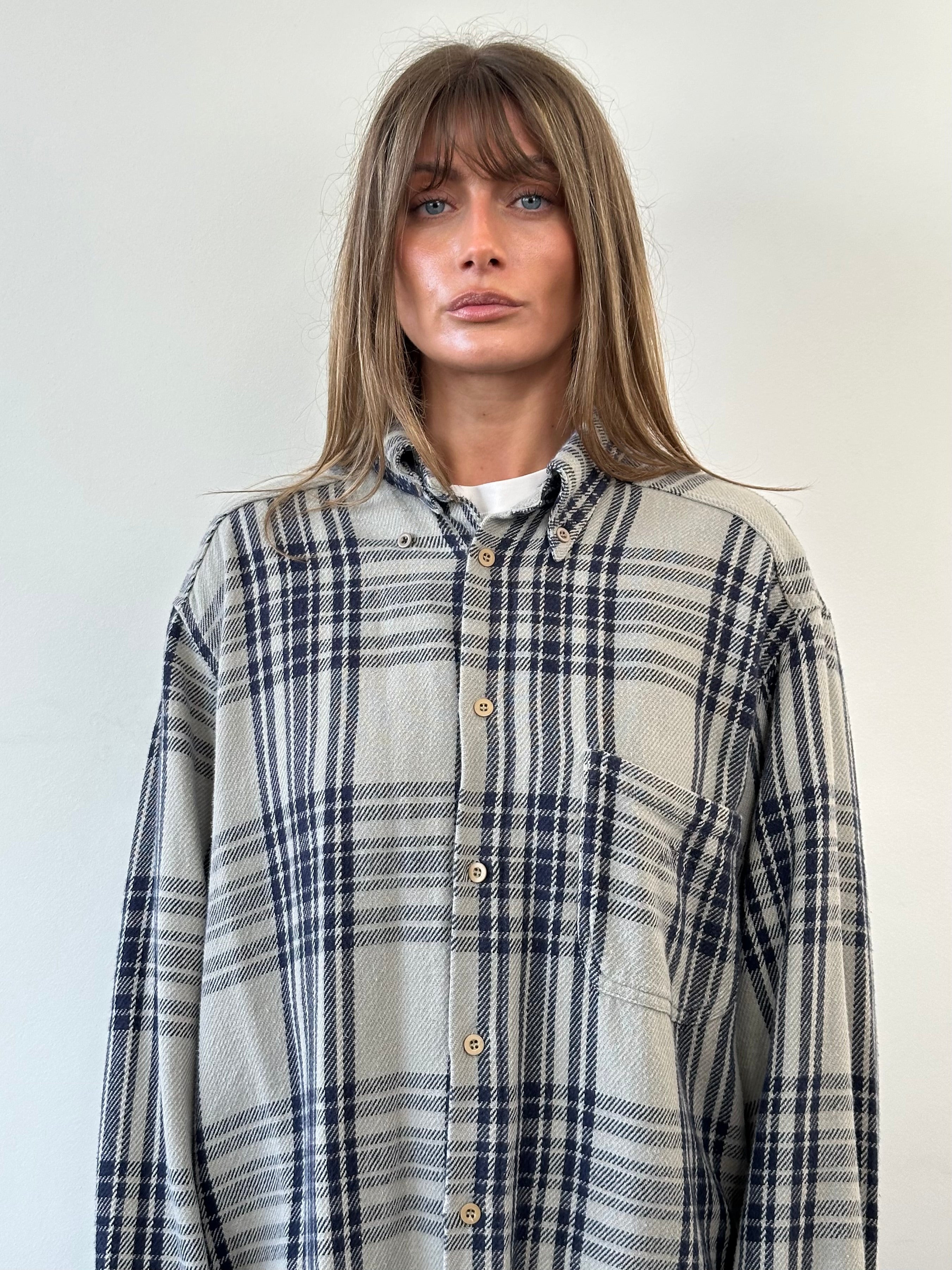 Armani Jeans check flannel logo shirt in size XL, featuring a classic plaid pattern and the Armani logo on the chest.
