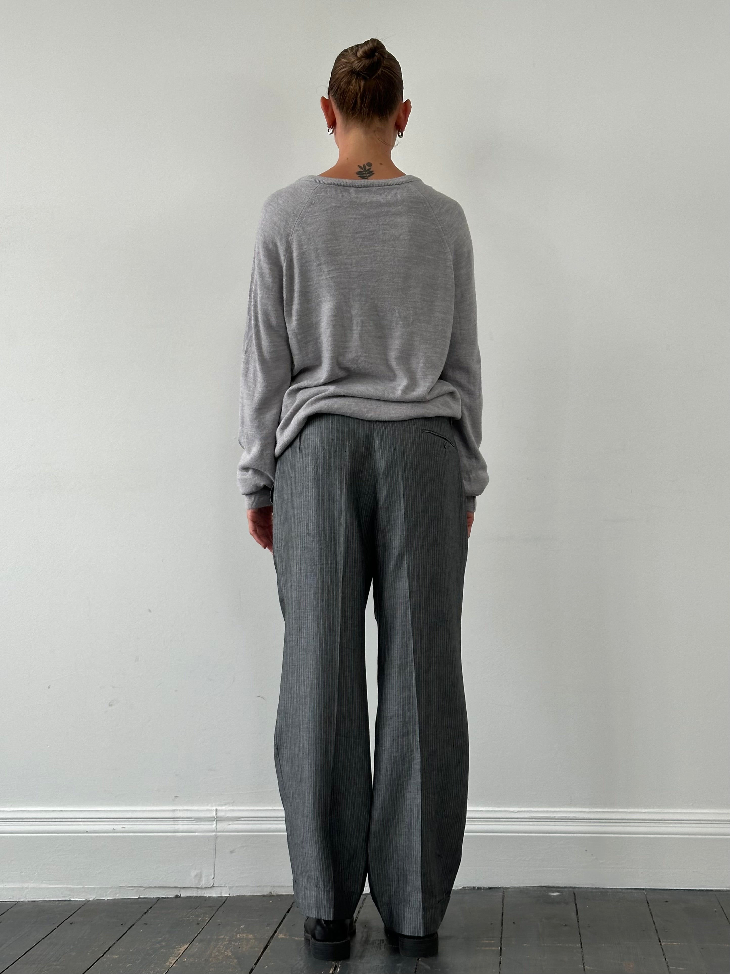 Christian Dior 1980s V-neck logo knitted jumper in size L/XL, featuring classic Dior branding and vintage knit fabric.