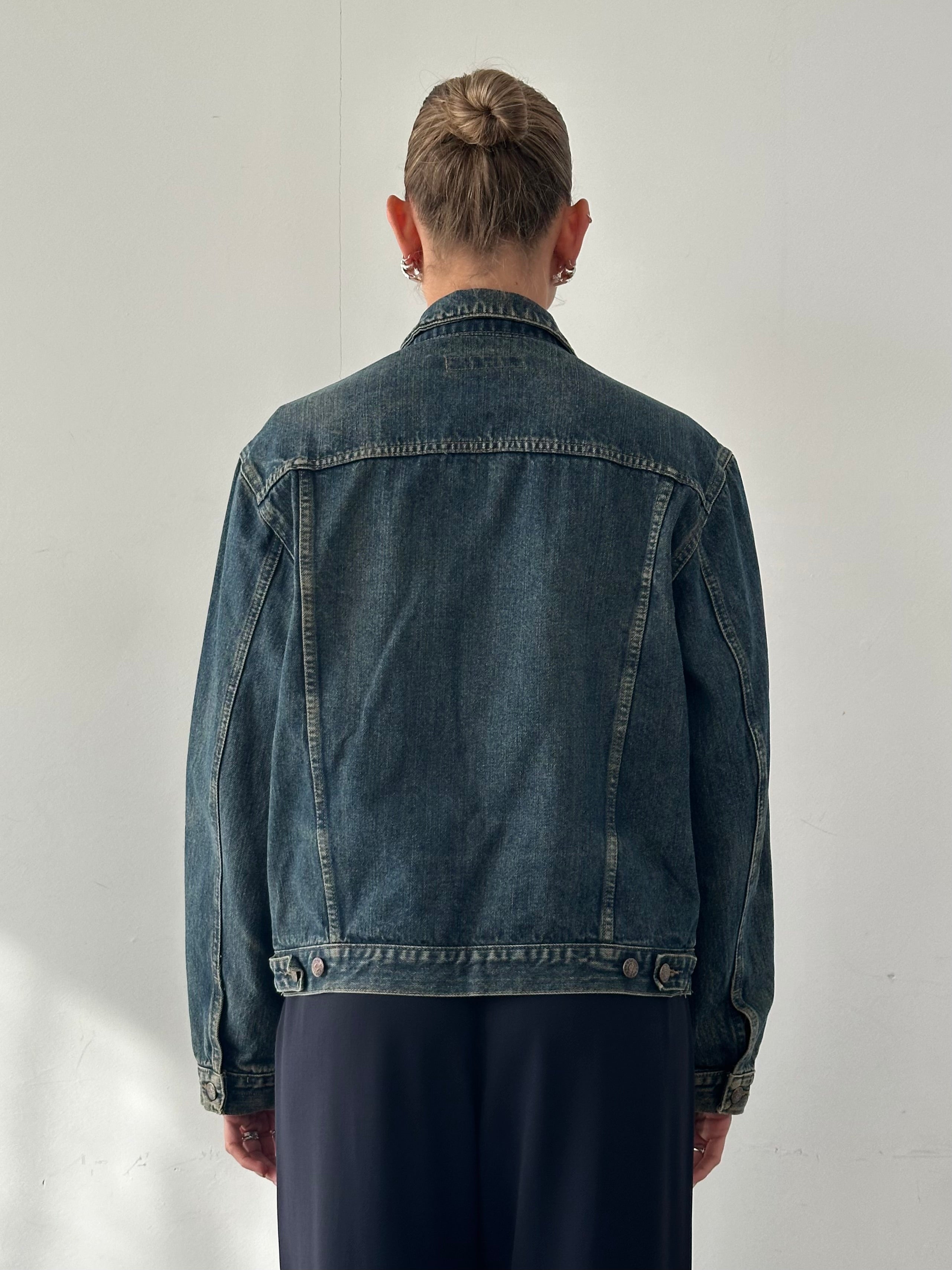 Vintage Italian washed denim jacket in M/L size, featuring classic design and distressed details.