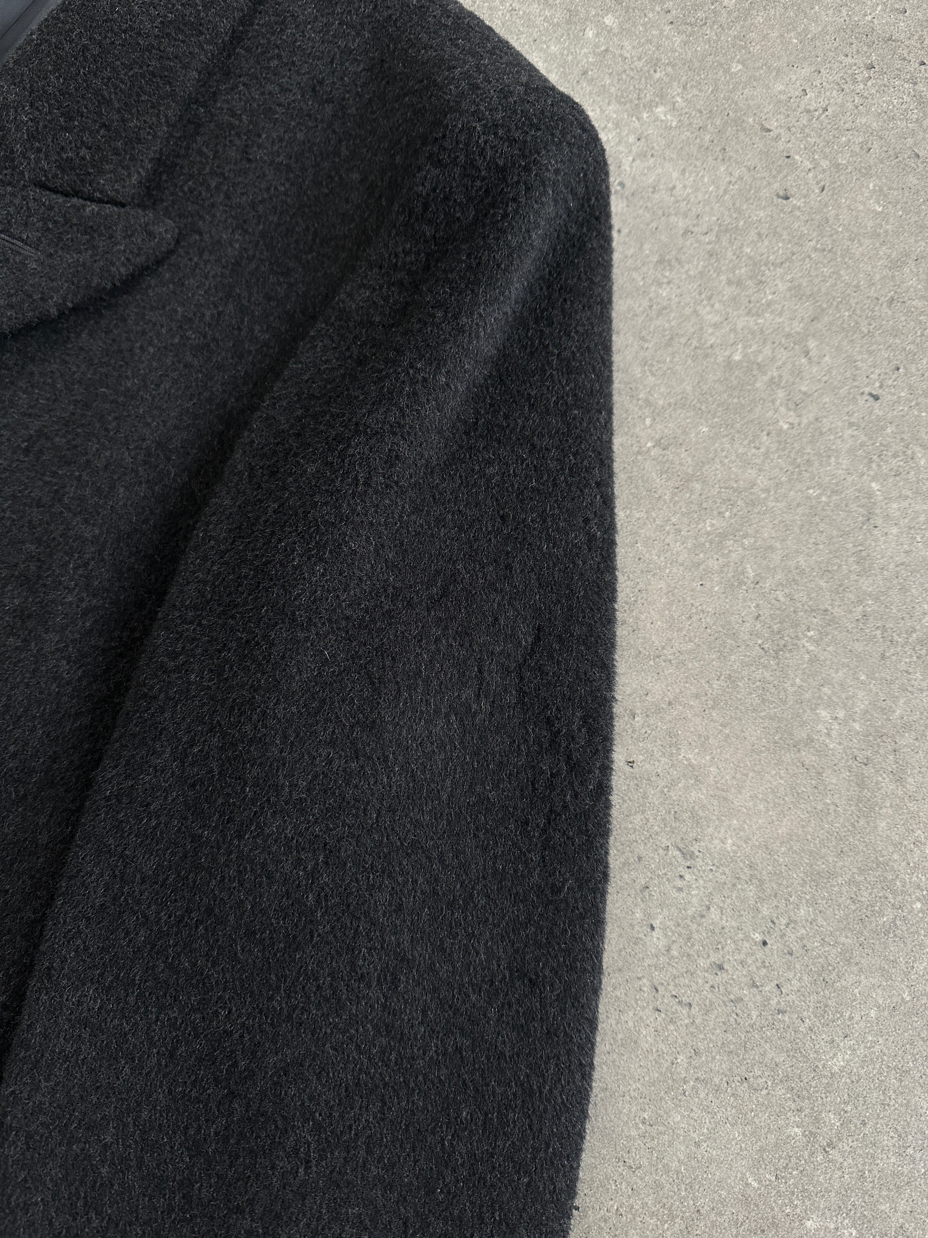 Vintage British 1990s wool cashmere double-breasted coat in XL, featuring classic design and textured fabric.