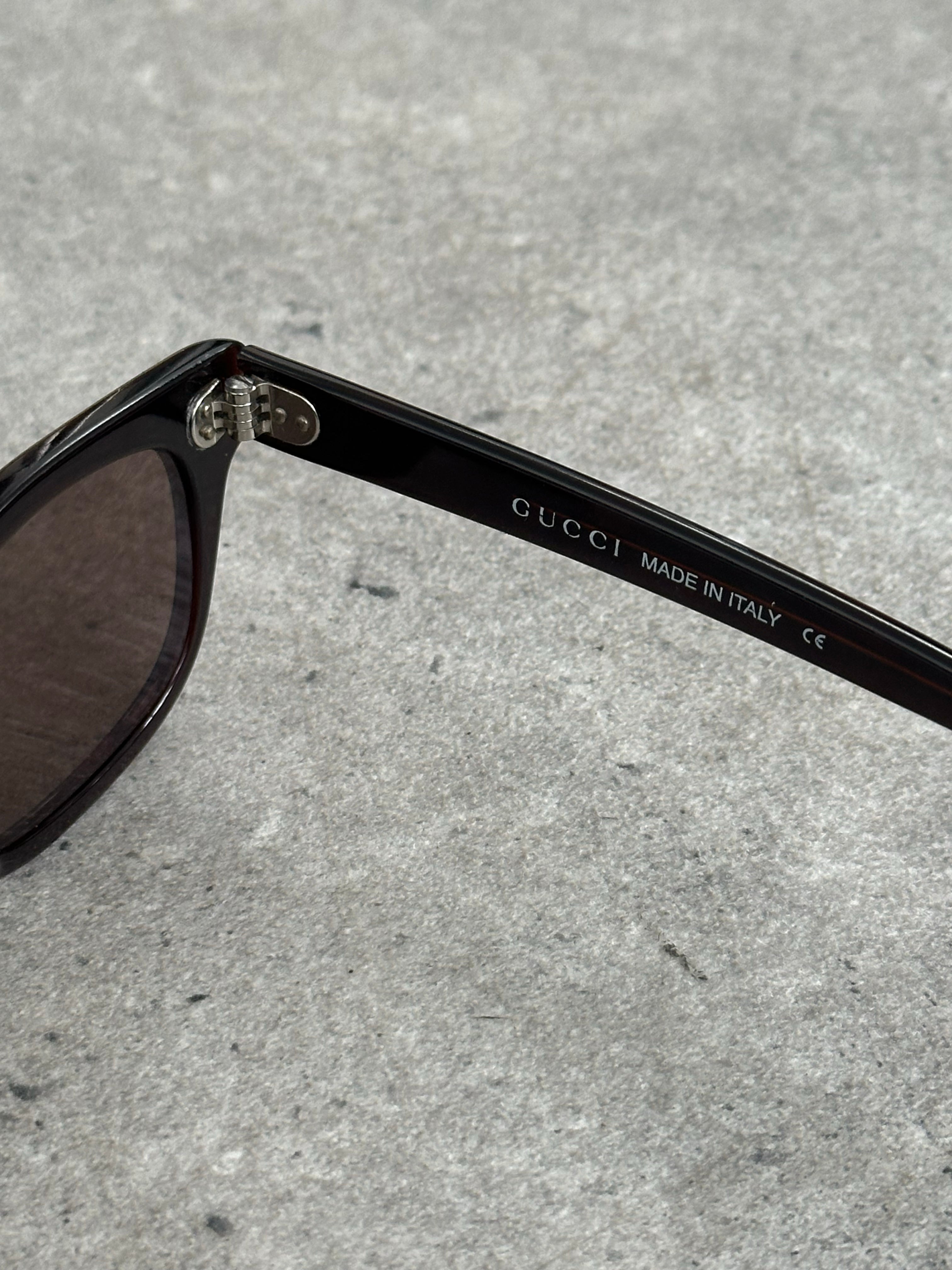Gucci 2000s Tom Ford tortoiseshell rectangle logo sunglasses with dark lenses and bold frame design.