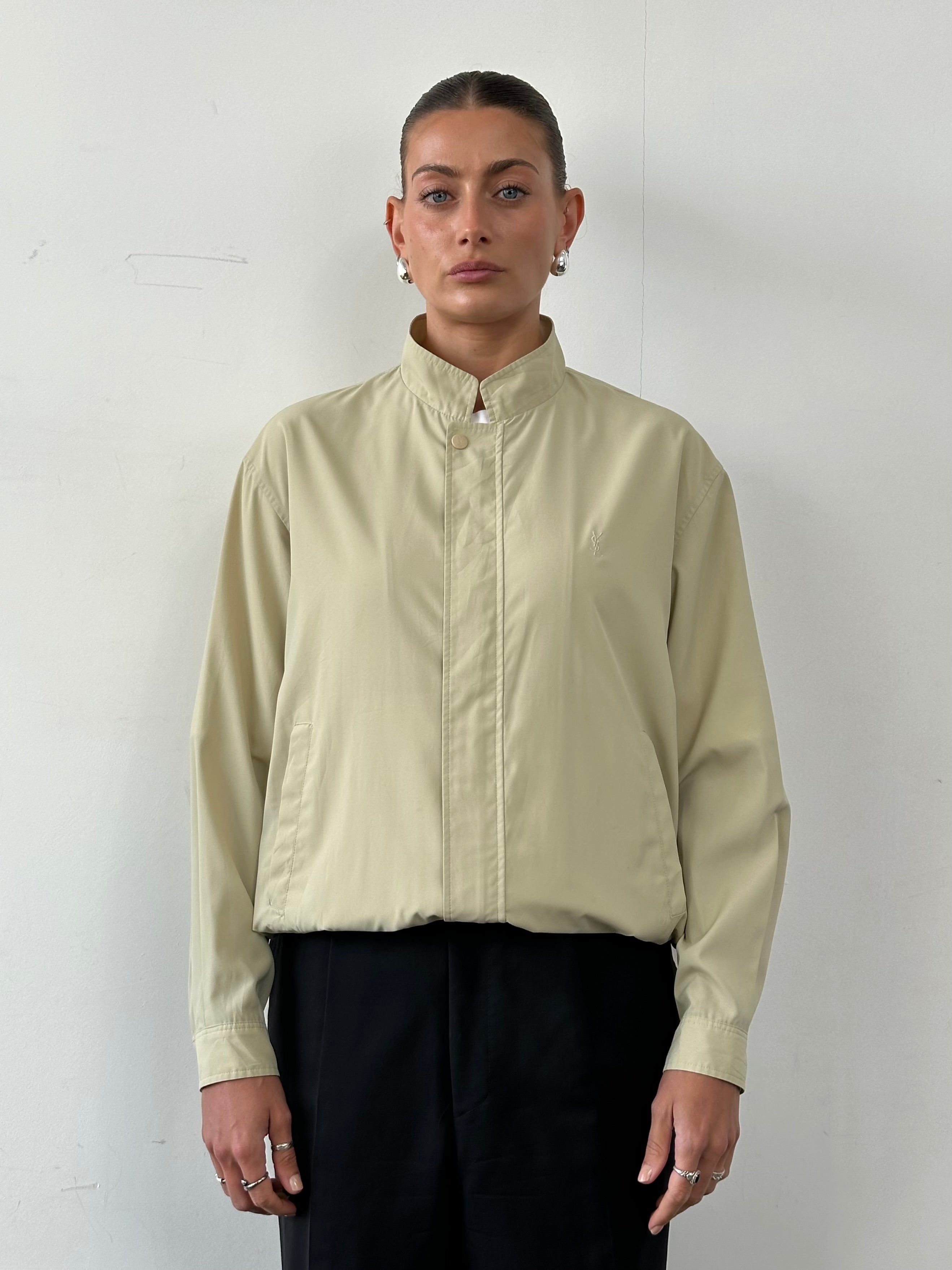Yves Saint Laurent Pour Homme logo bomber jacket in size M/L, black with signature branding and zip closure.