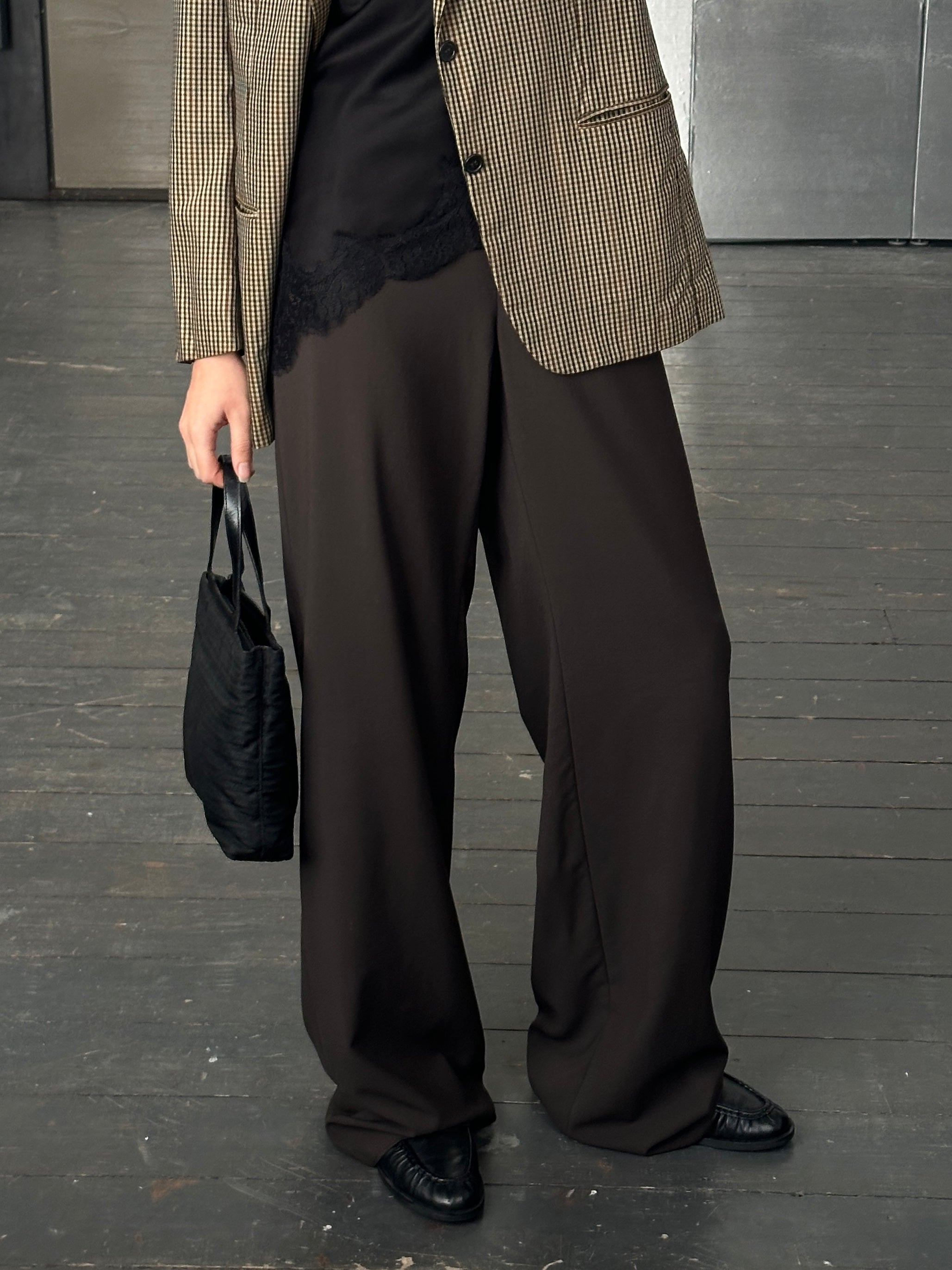 Armani Collezioni wide leg tailored trousers in pure wool, size W34, shown on a model with a neutral background.