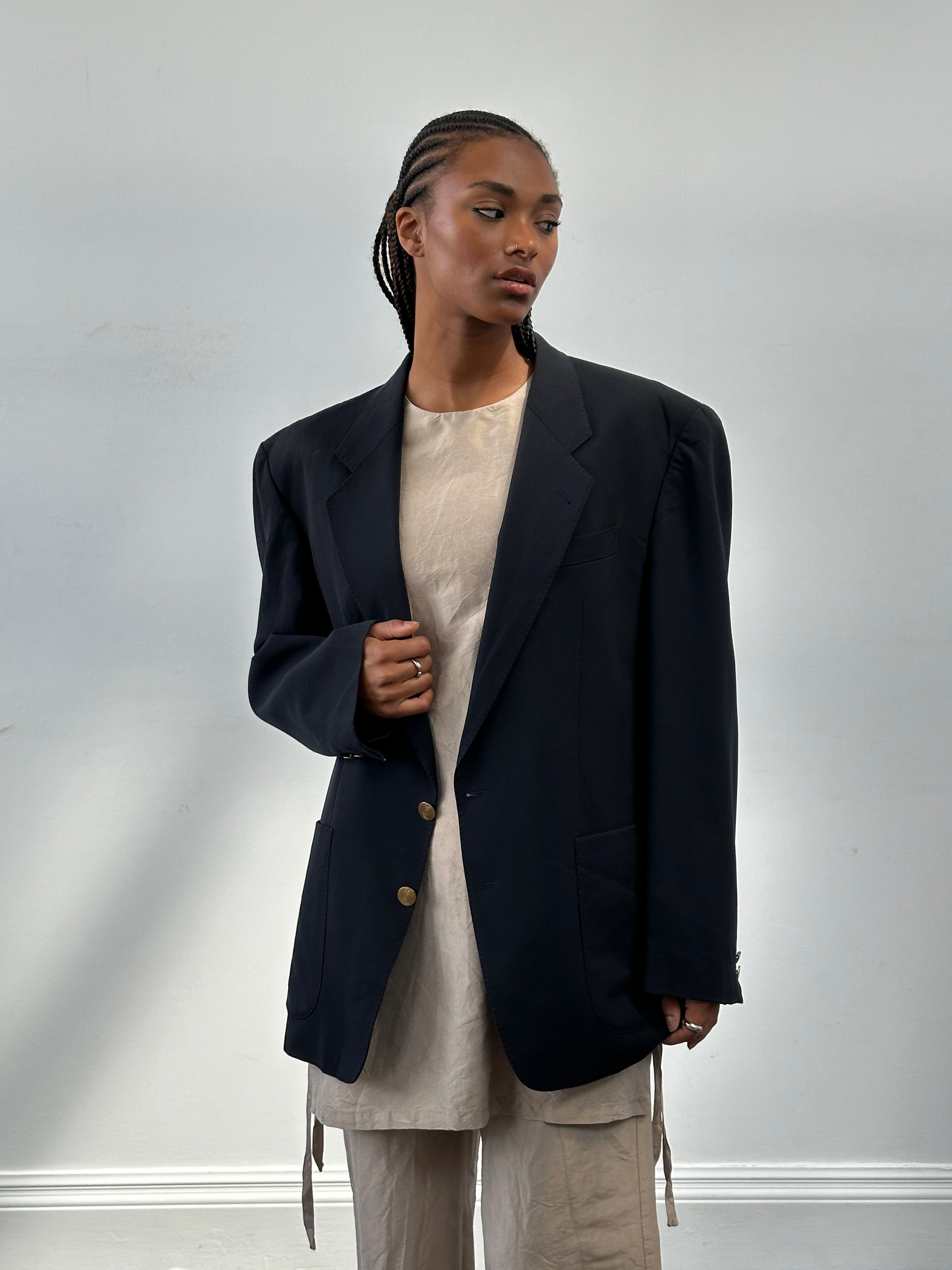 Yves Saint Laurent Diffusion Hommes 1980s pure wool bespoke button blazer in size 42R/XL, shown on a hanger with a classic design.