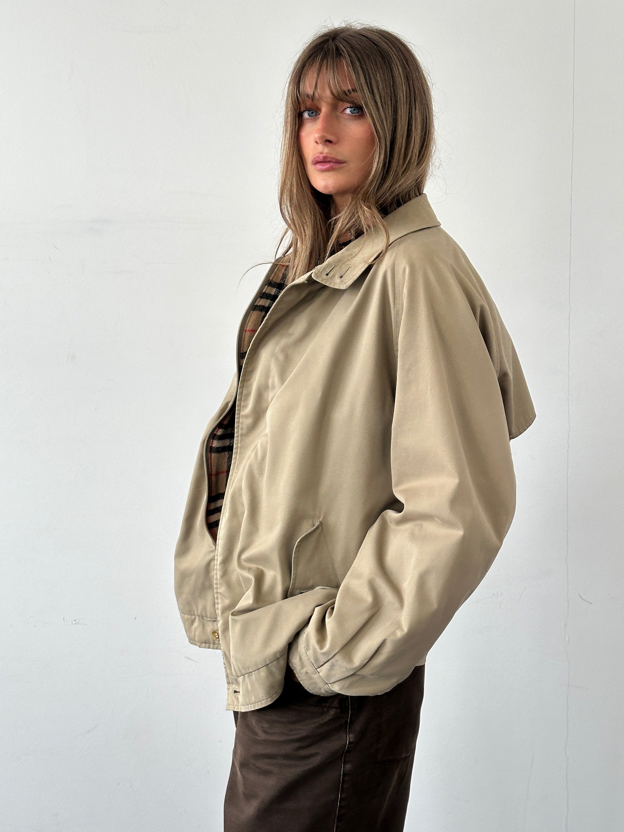 Burberry Nova Check bomber jacket in size L, featuring classic check pattern, ribbed cuffs, and front zipper.